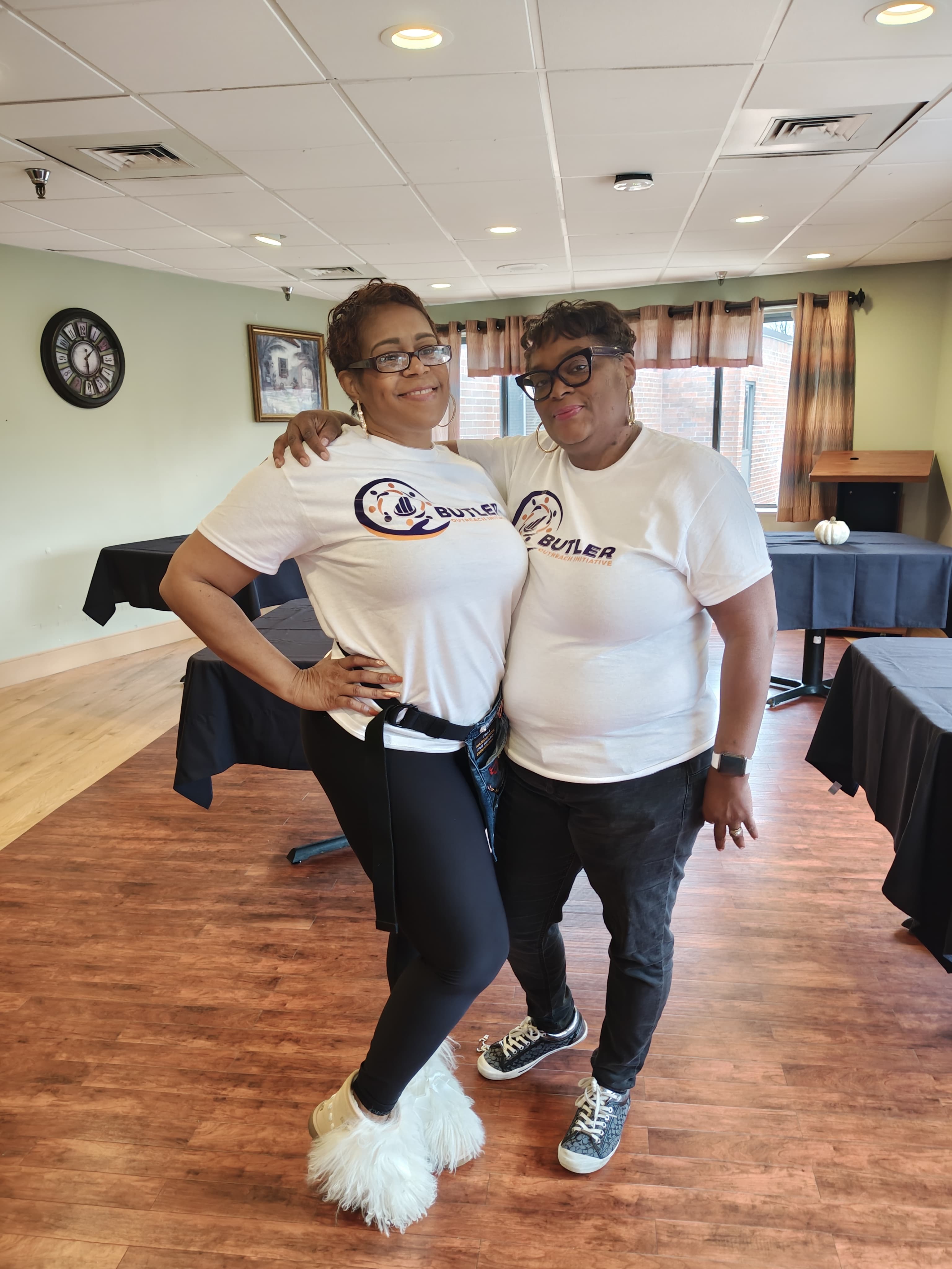 Barbara Butler during a community outreach event with volunteers and supplies