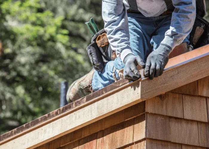 roofer on a roof drip edge