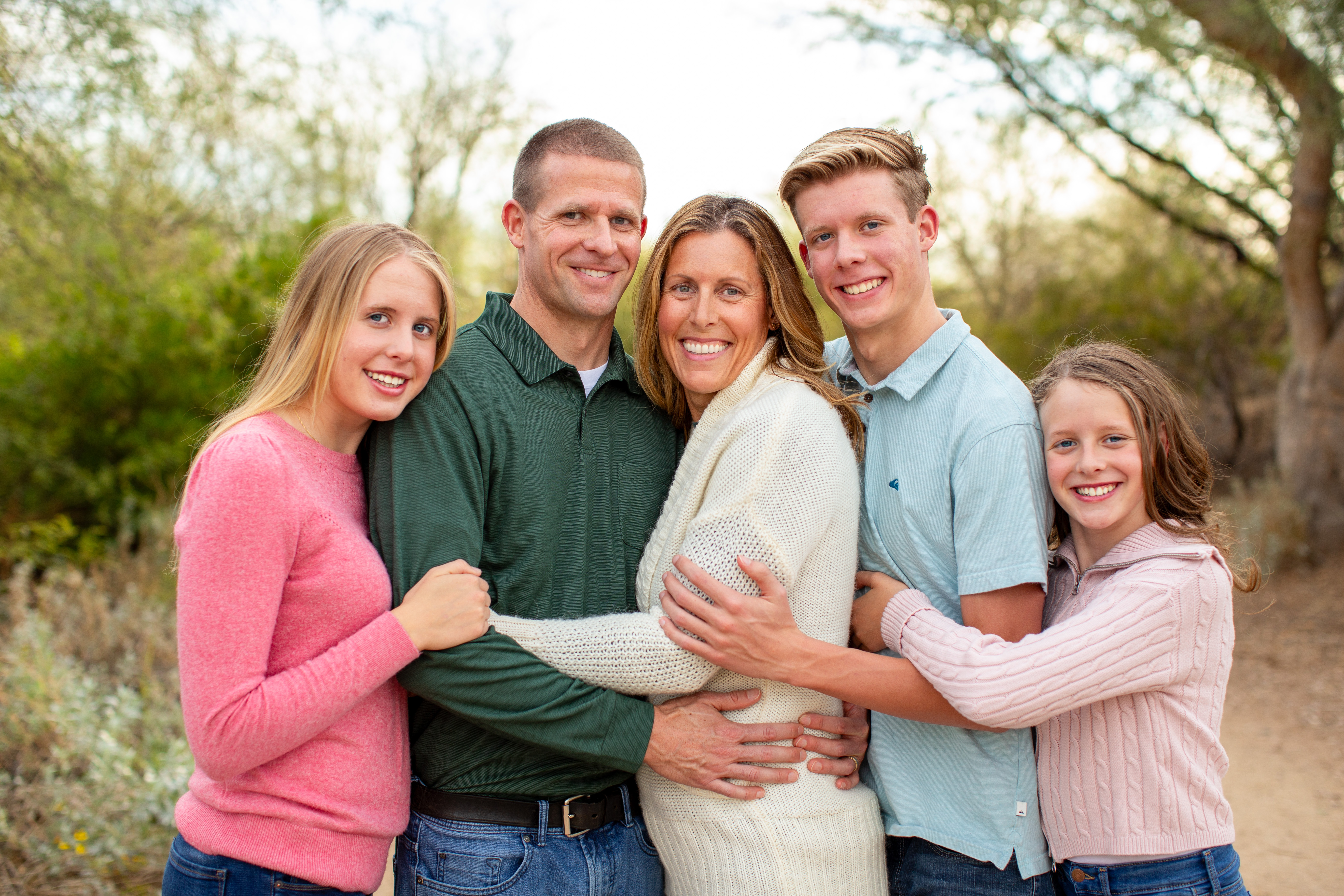 A natural, outdoor family portrait captured at sunset in Veterans Oasis Park, Chandler, Arizona, by Andria May Photography. A natural, outdoor family portrait captured at sunset in Veterans Oasis Park, Chandler, Arizona, by Andria May Photography.