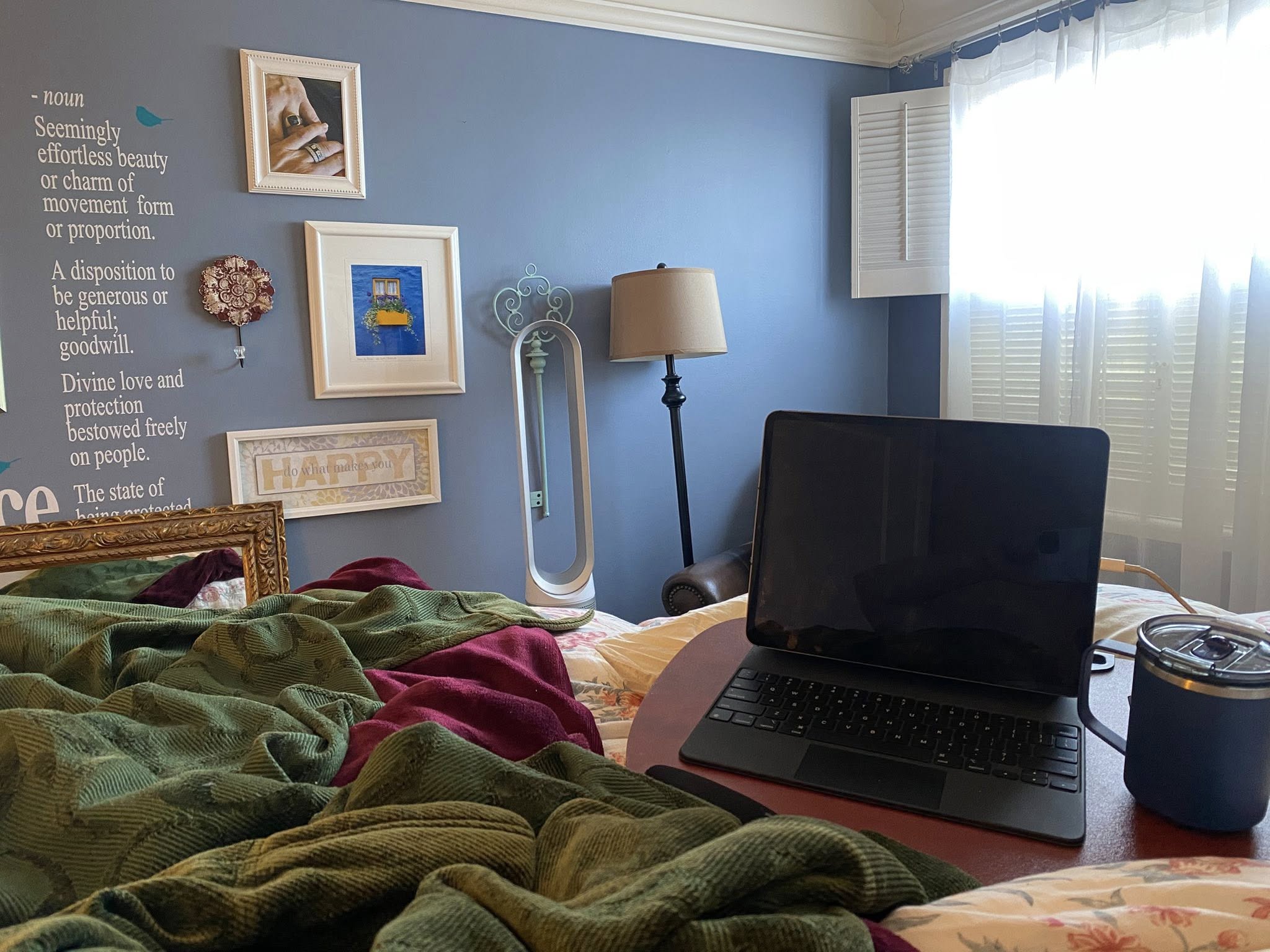 Woman lounging in bed under blankets, sipping tea, creating and resting in a cozy sanctuary. Woman lounging in bed under blankets, sipping tea, creating and resting in a cozy sanctuary.