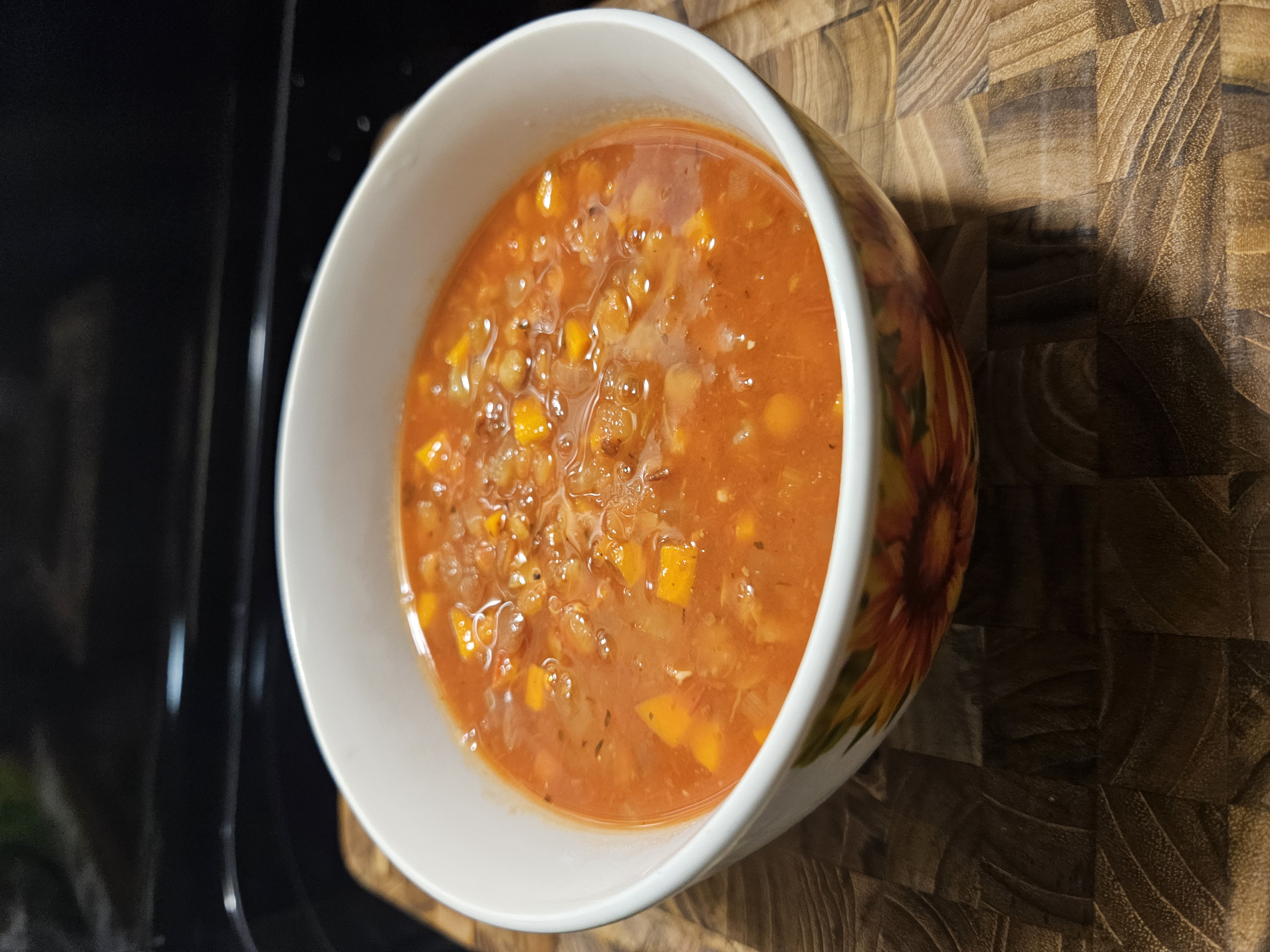 Warm bowl of vegan lentil soup with carrots, celery, and herbs Warm bowl of vegan lentil soup with carrots, celery, and herbs