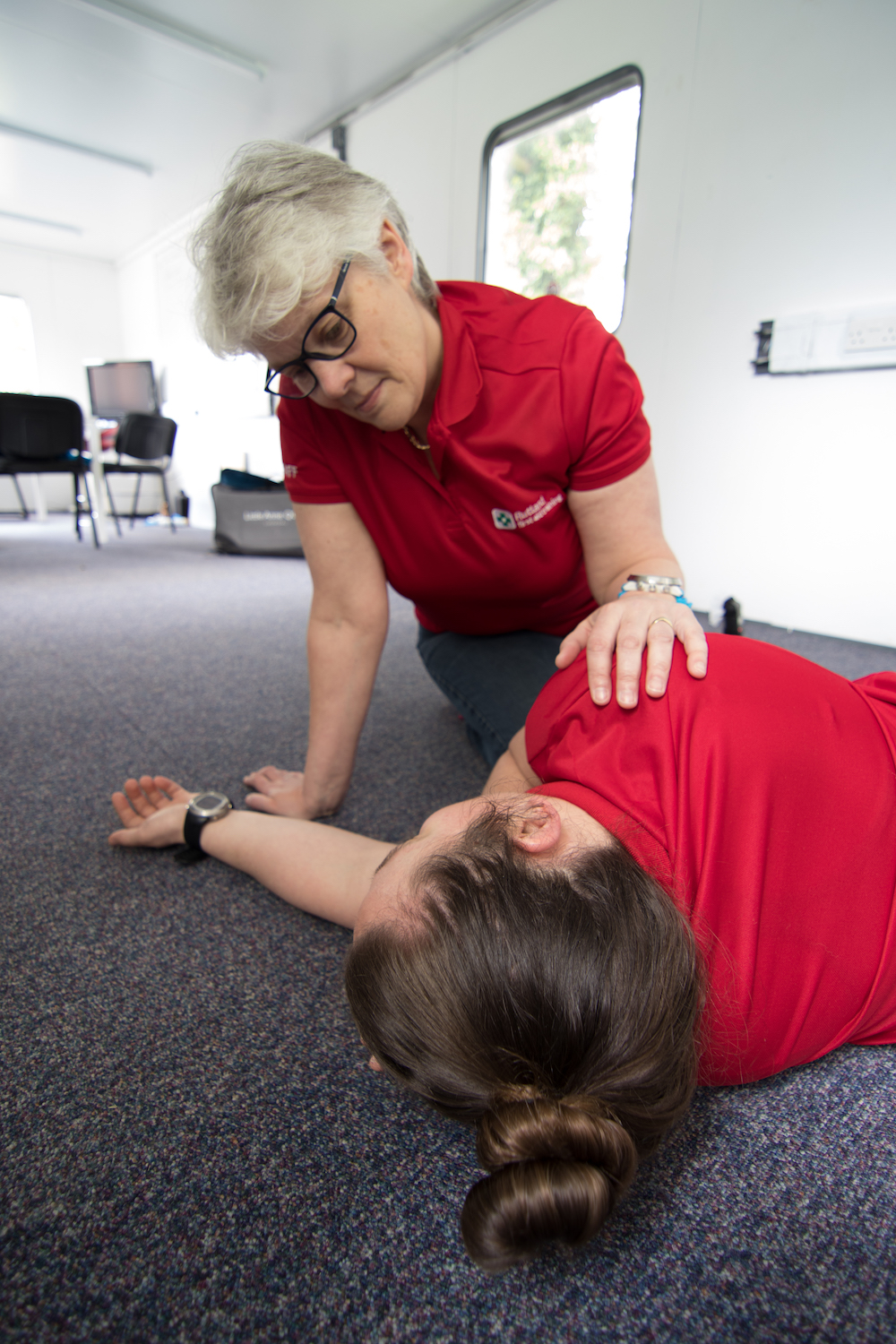 Casualty being monitored whilst in Recovery Position