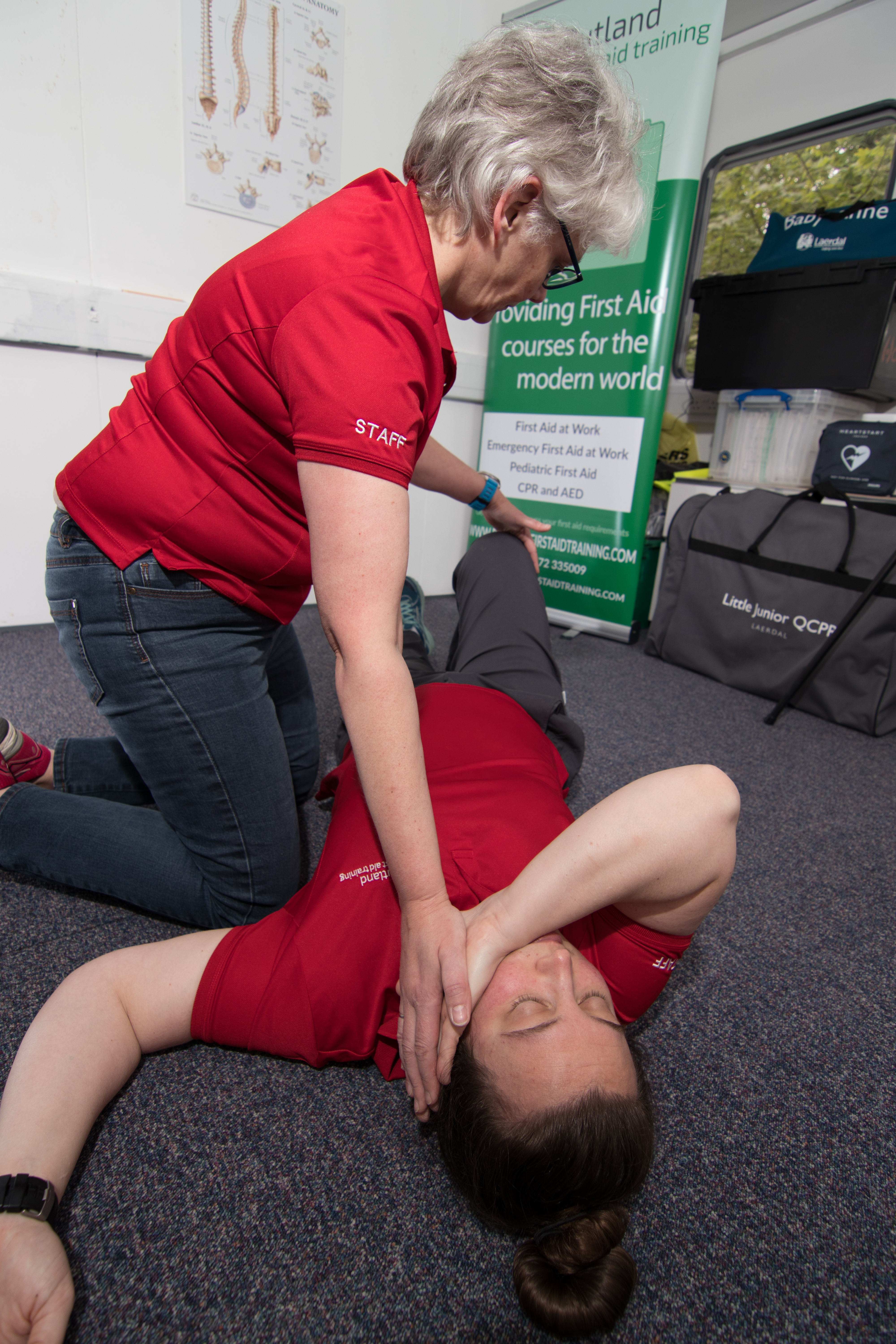 Recovery Position - Preparing to roll the casualty