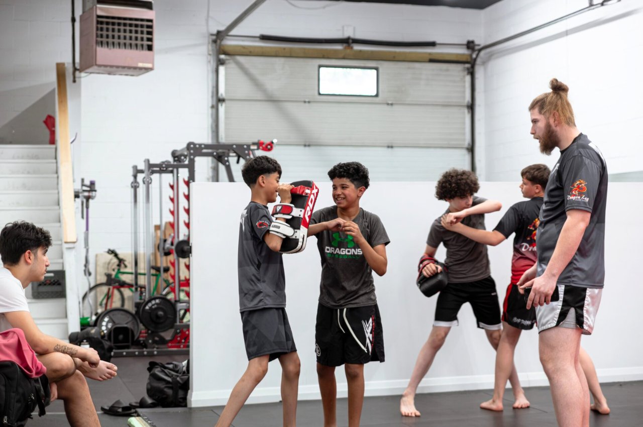 Martial arts instructor with kids