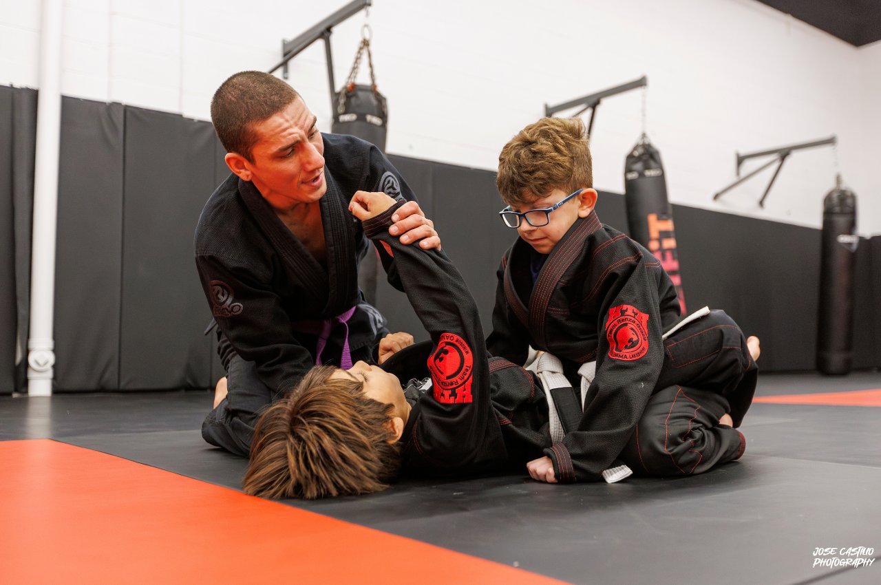 Martial arts instructor with kids