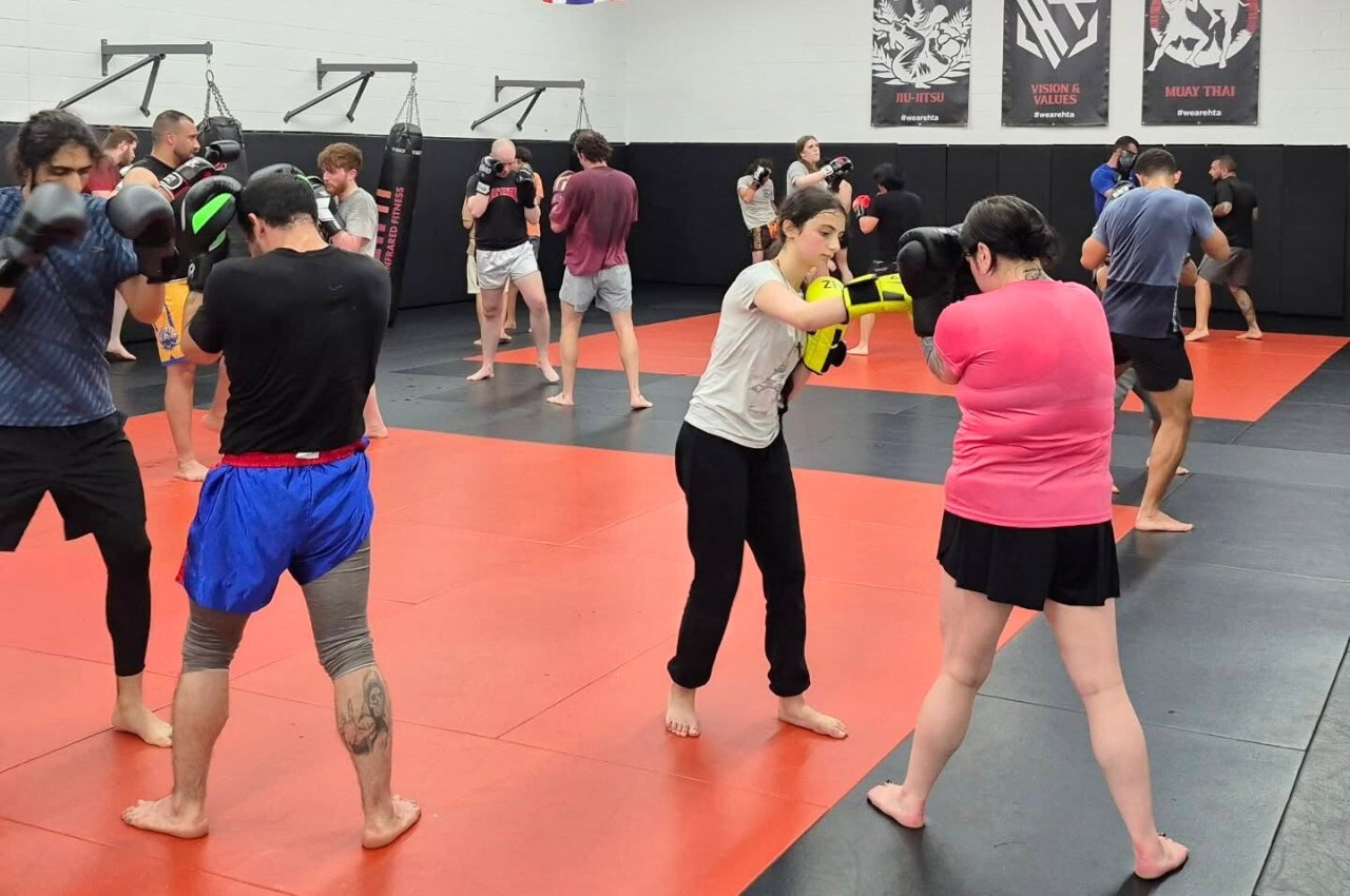 Martial arts instructor with kids