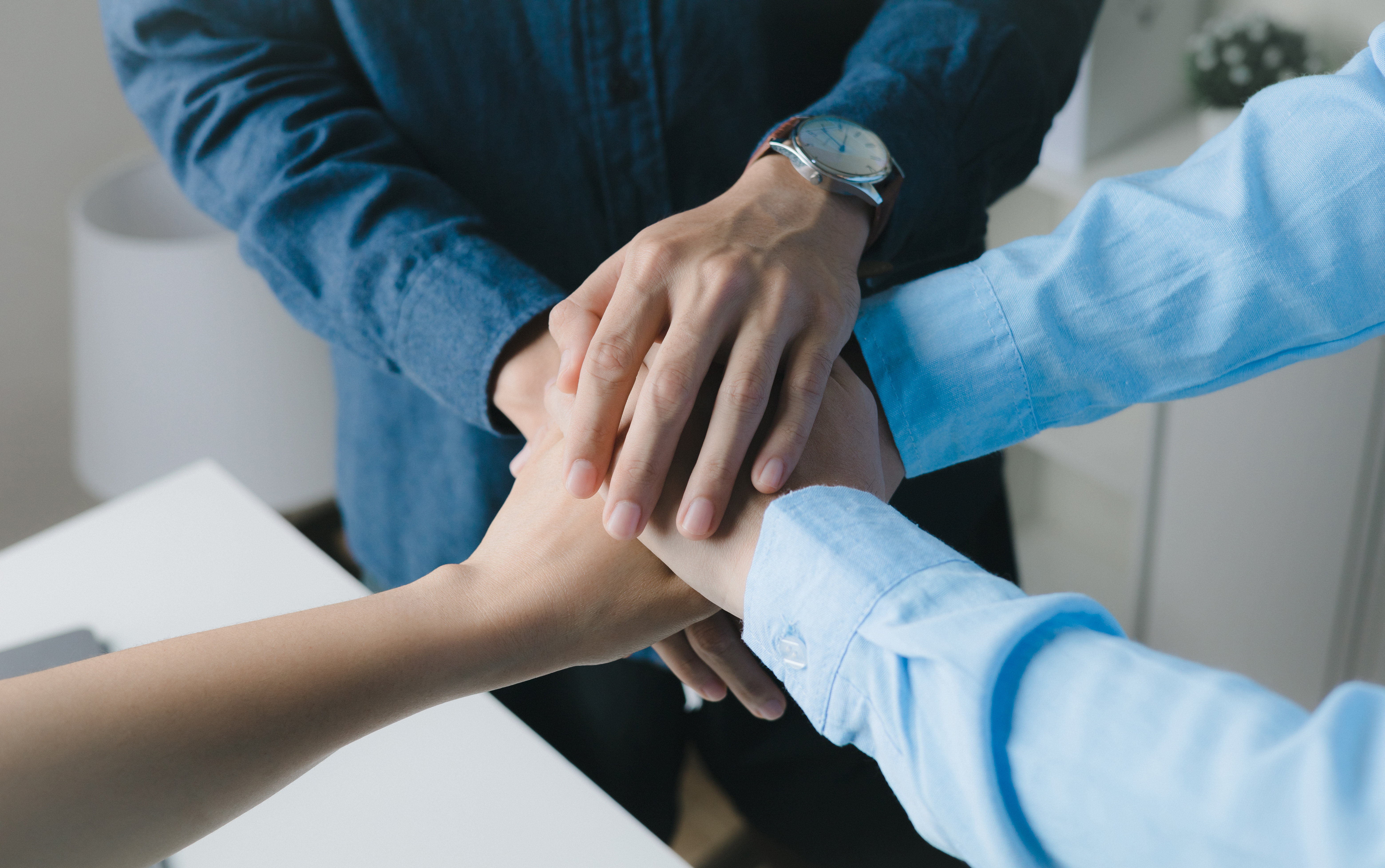 Image of Team Member Hands Showing Team Alignment