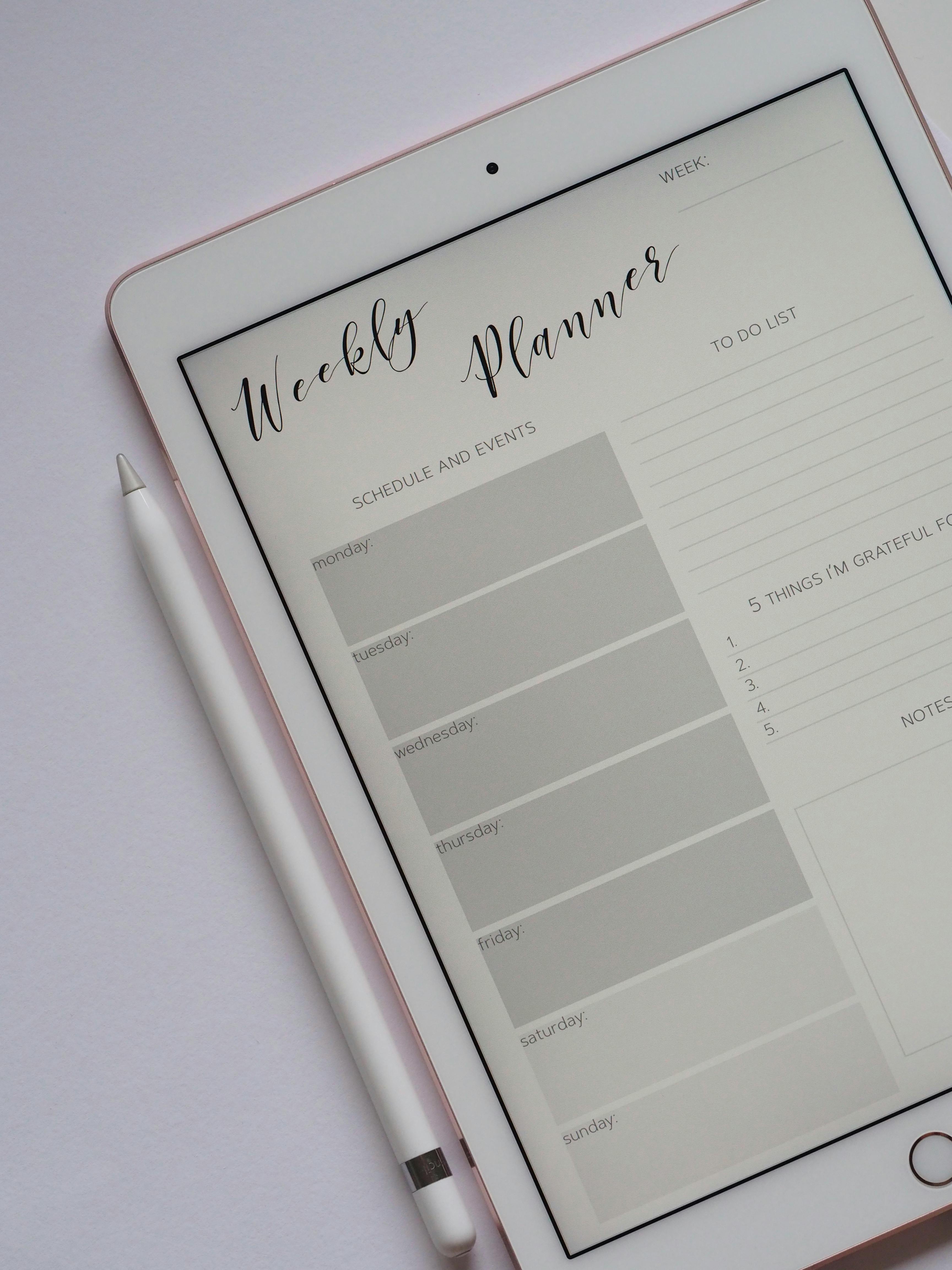 close up photo of an ipad weekly planner close up photo of an ipad weekly planner