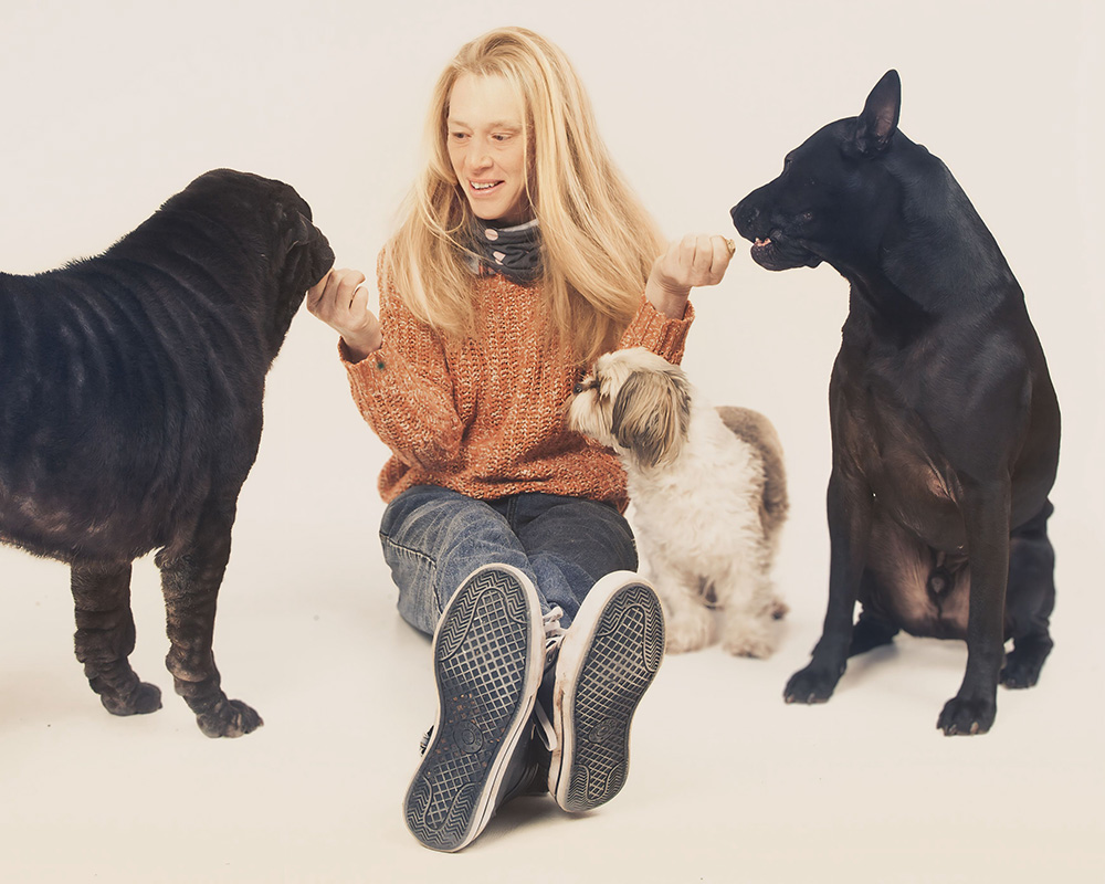 Marcia feeding dogs