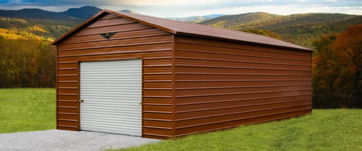 Brown metal storage building with roll-up door set against a scenic mountain backdrop. Brown metal storage building with roll-up door set against a scenic mountain backdrop.