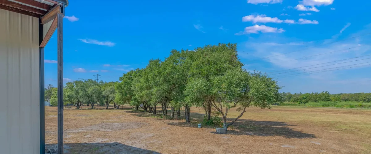 Rural property landscape viewed from metal building
