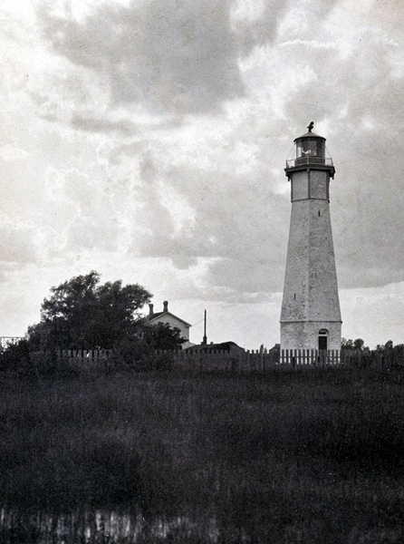 Gibraltar Point Lighthouse historical photograph early 20th century - vintage black and white image stone lighthouse tower keeper's house wooden picket fence Toronto Islands Lake Ontario Canada oldest lighthouse maritime navigation heritage site