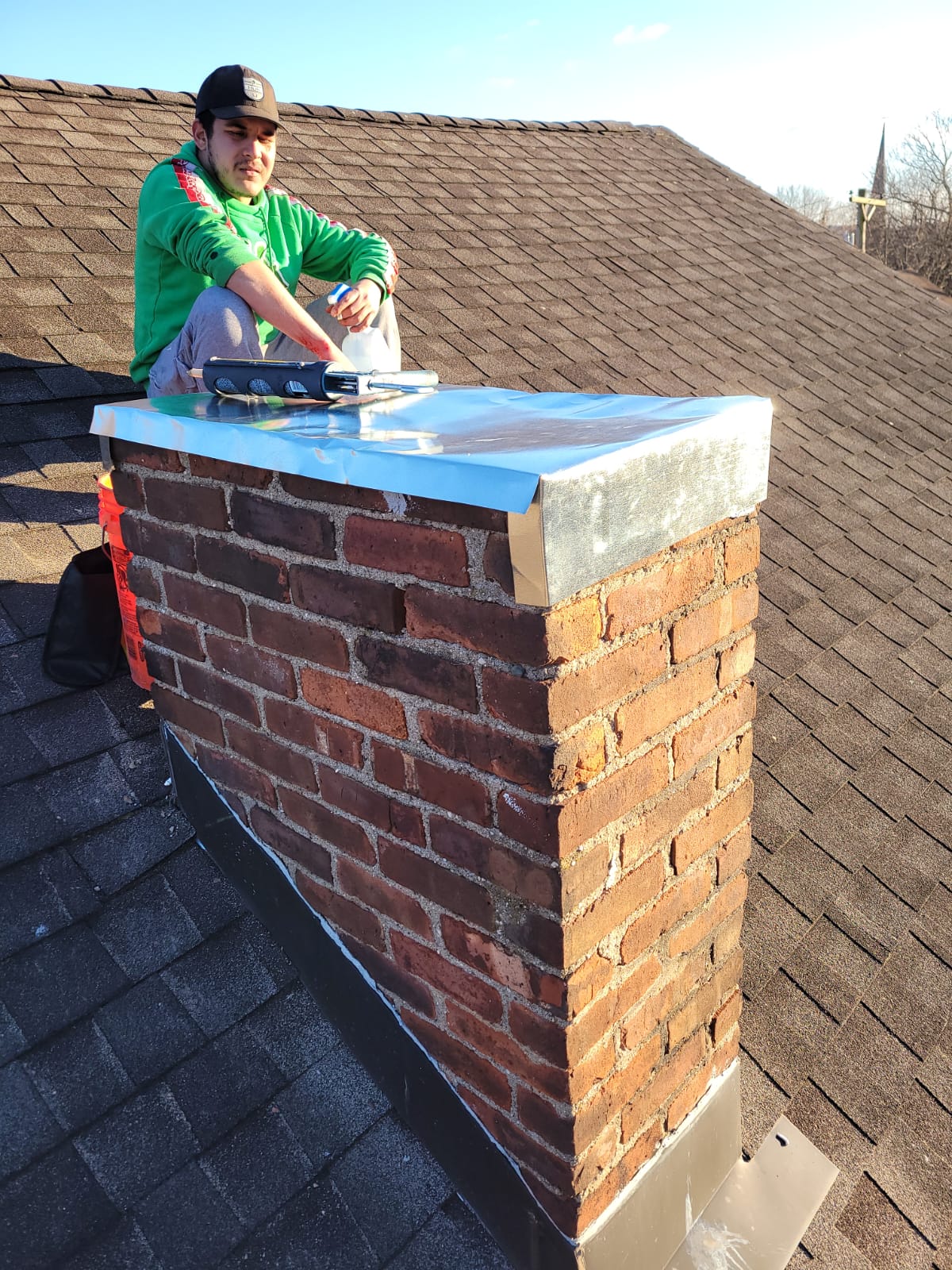 FantaskTeam technician performing chimney repair on a Denver, Colorado home