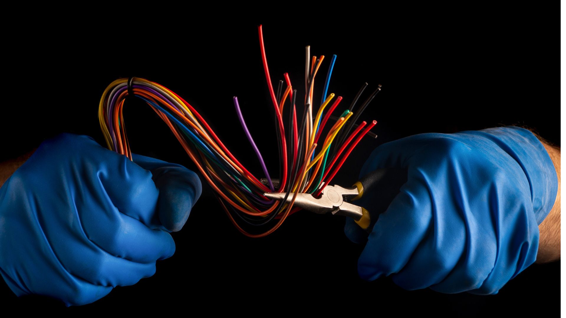 Professional electrician working on a circuit breaker panel