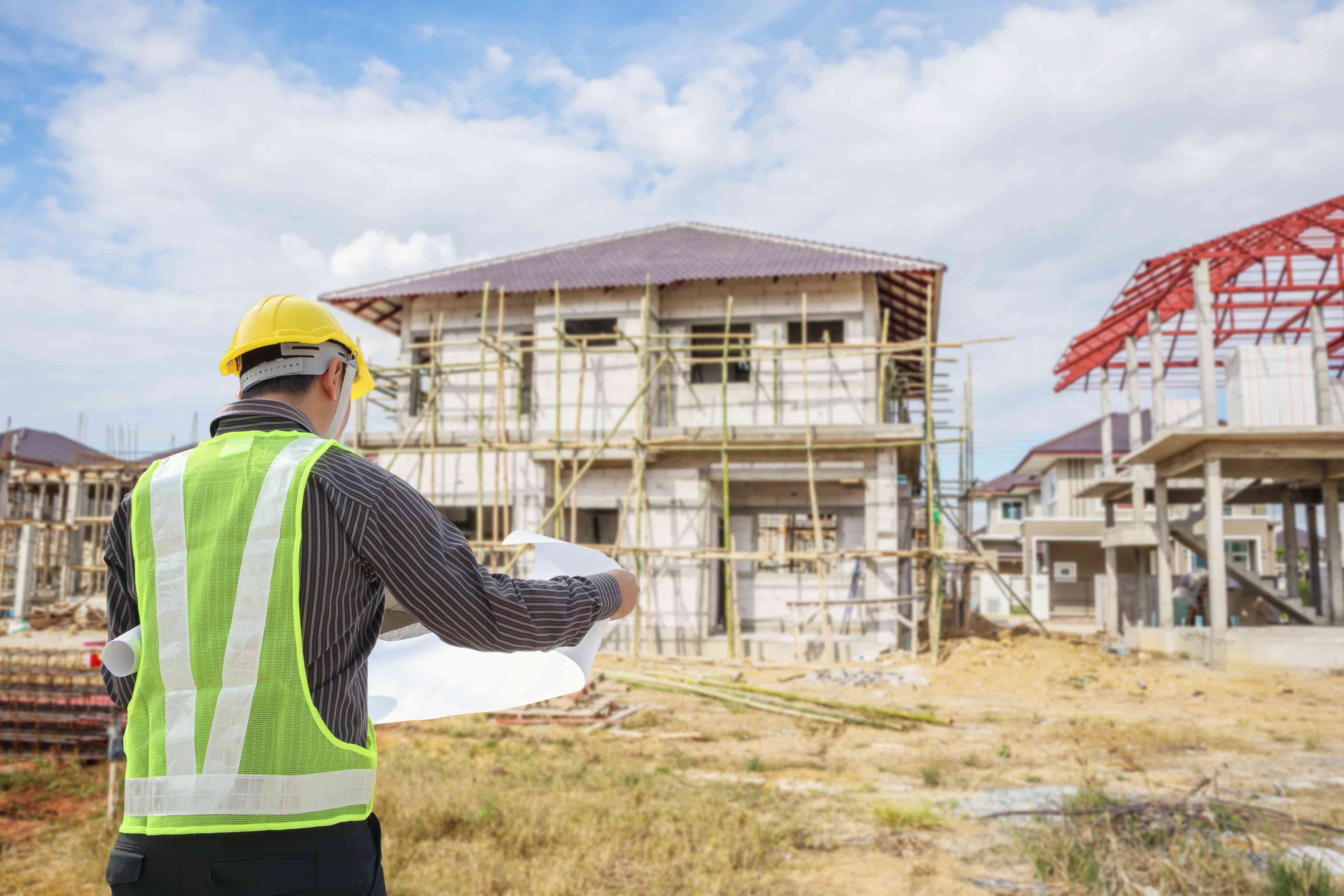 Professional surveyor inspecting a building