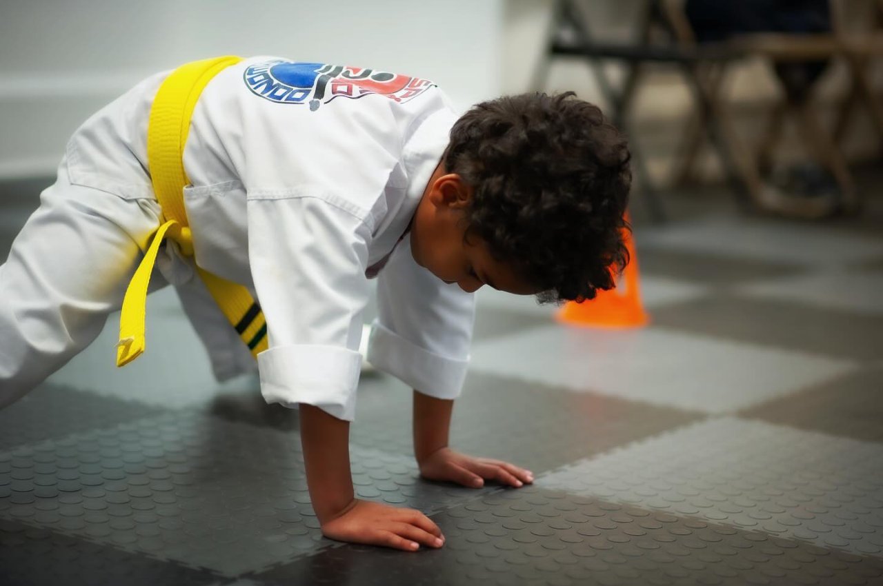 Martial arts instructor with kids