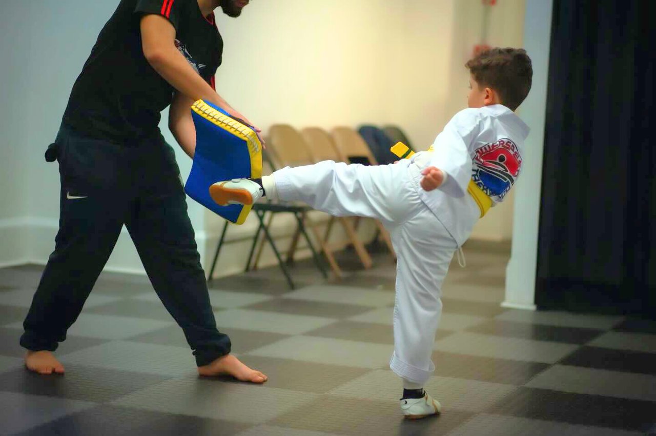 Martial arts instructor with kids