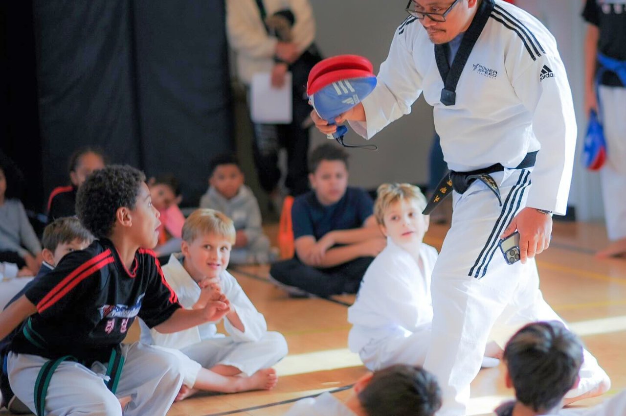 Martial arts instructor with kids