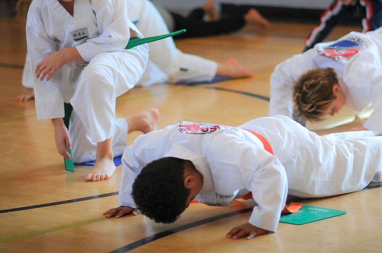 Martial arts instructor with kids