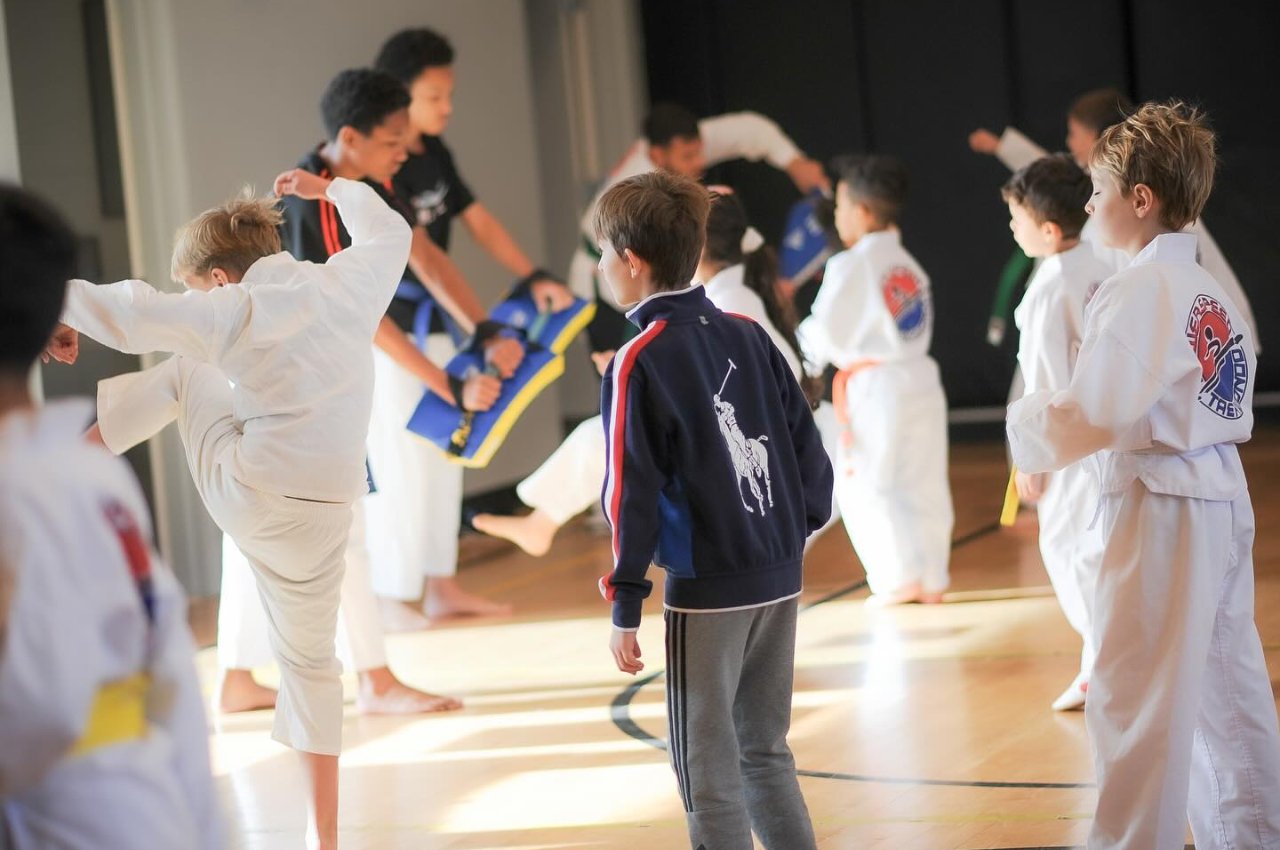 Martial arts instructor with kids