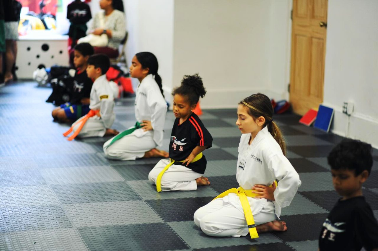 Martial arts instructor with kids