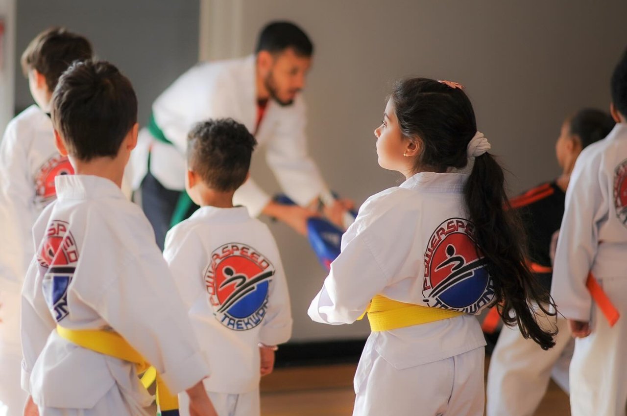 Martial arts instructor with kids
