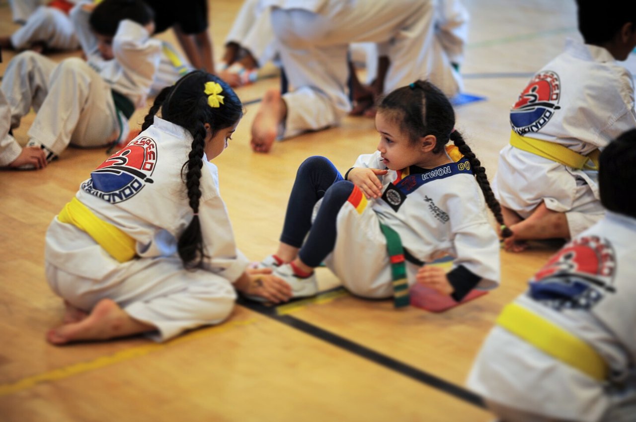 Martial arts instructor with kids