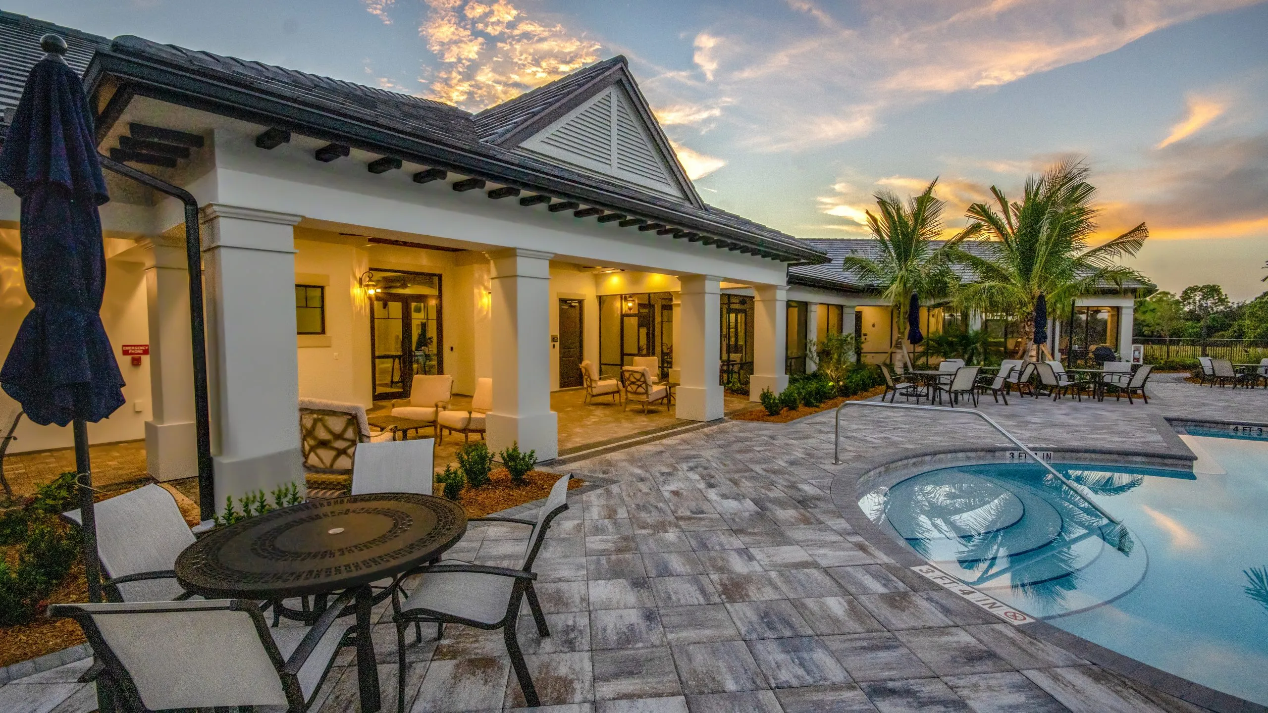 Divosta Pulte Clubhouse Exterior Pool Sunset Building