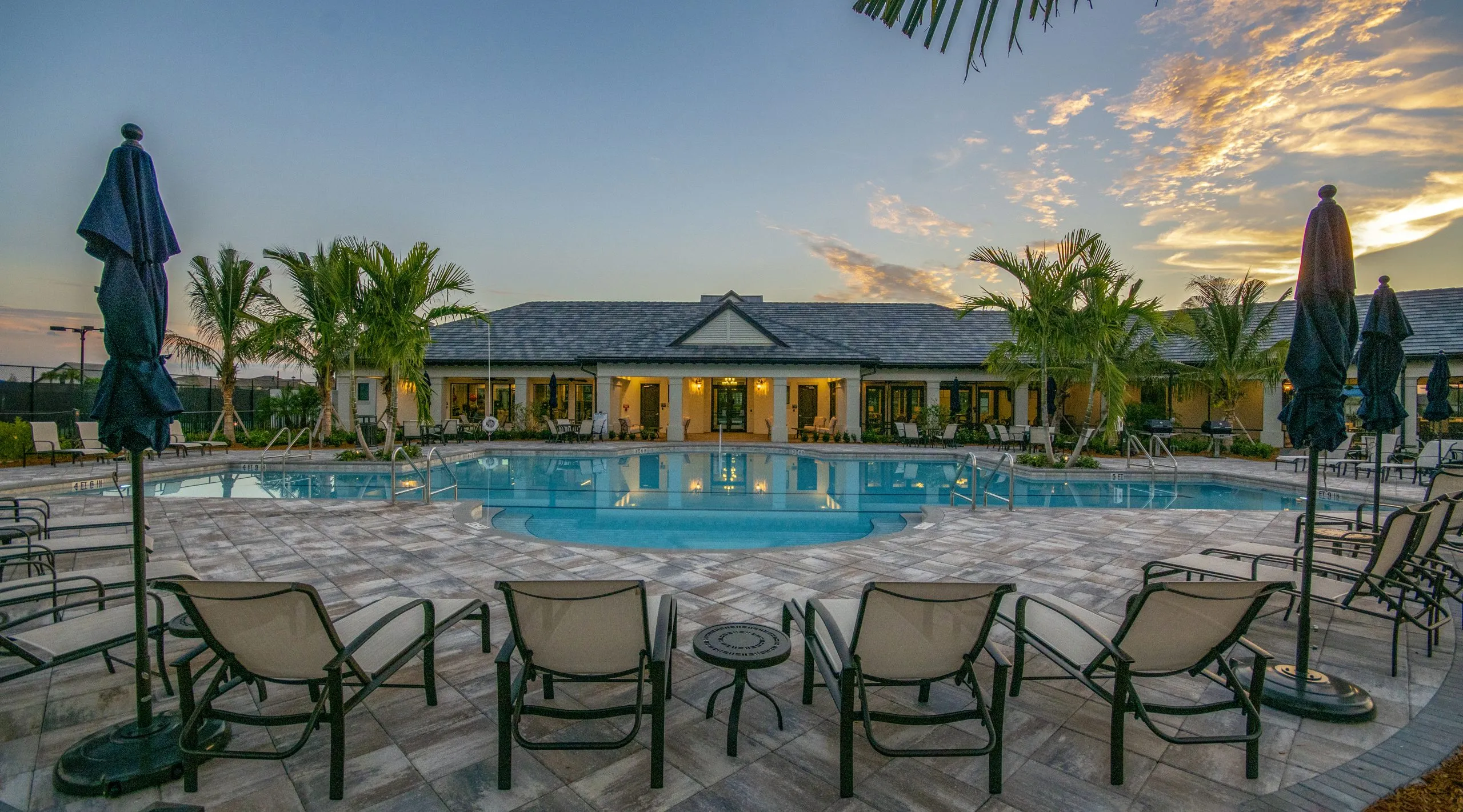 Divosta Pulte Clubhouse Exterior Pool Sunset Building