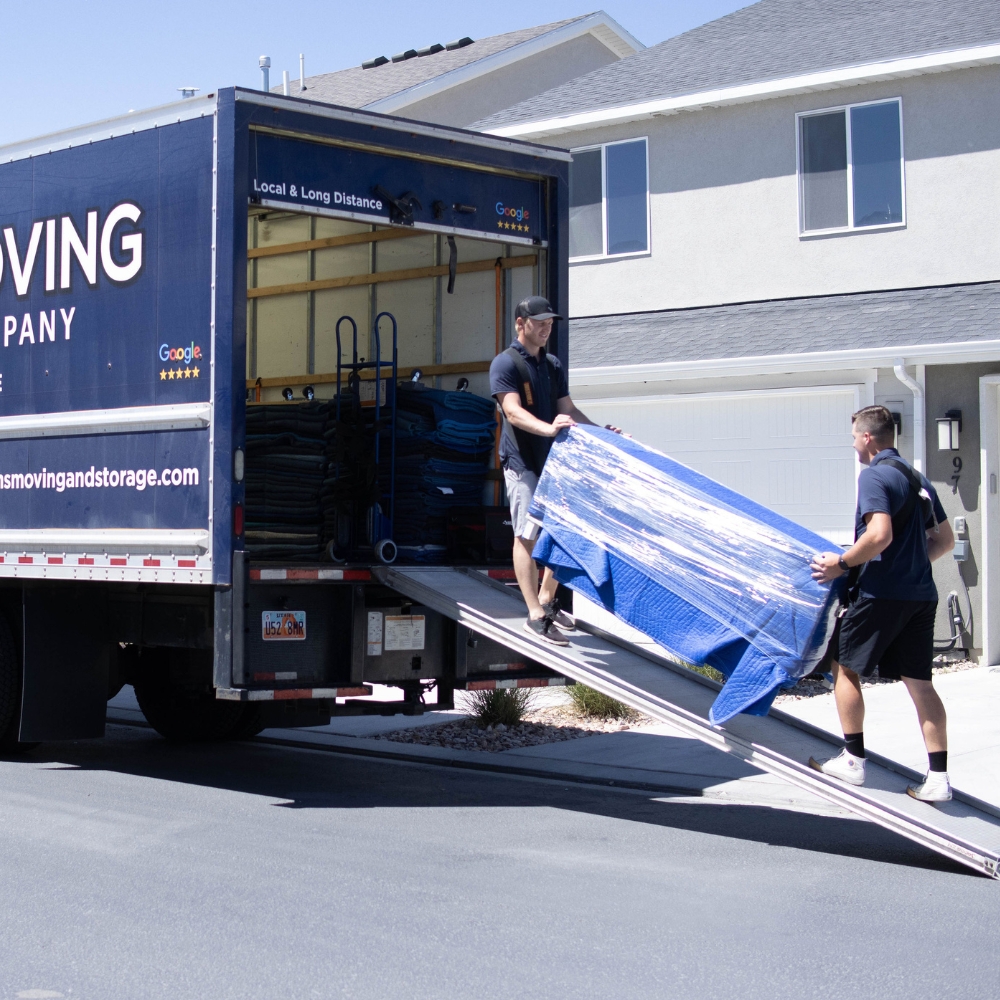 Professional movers loading furniture