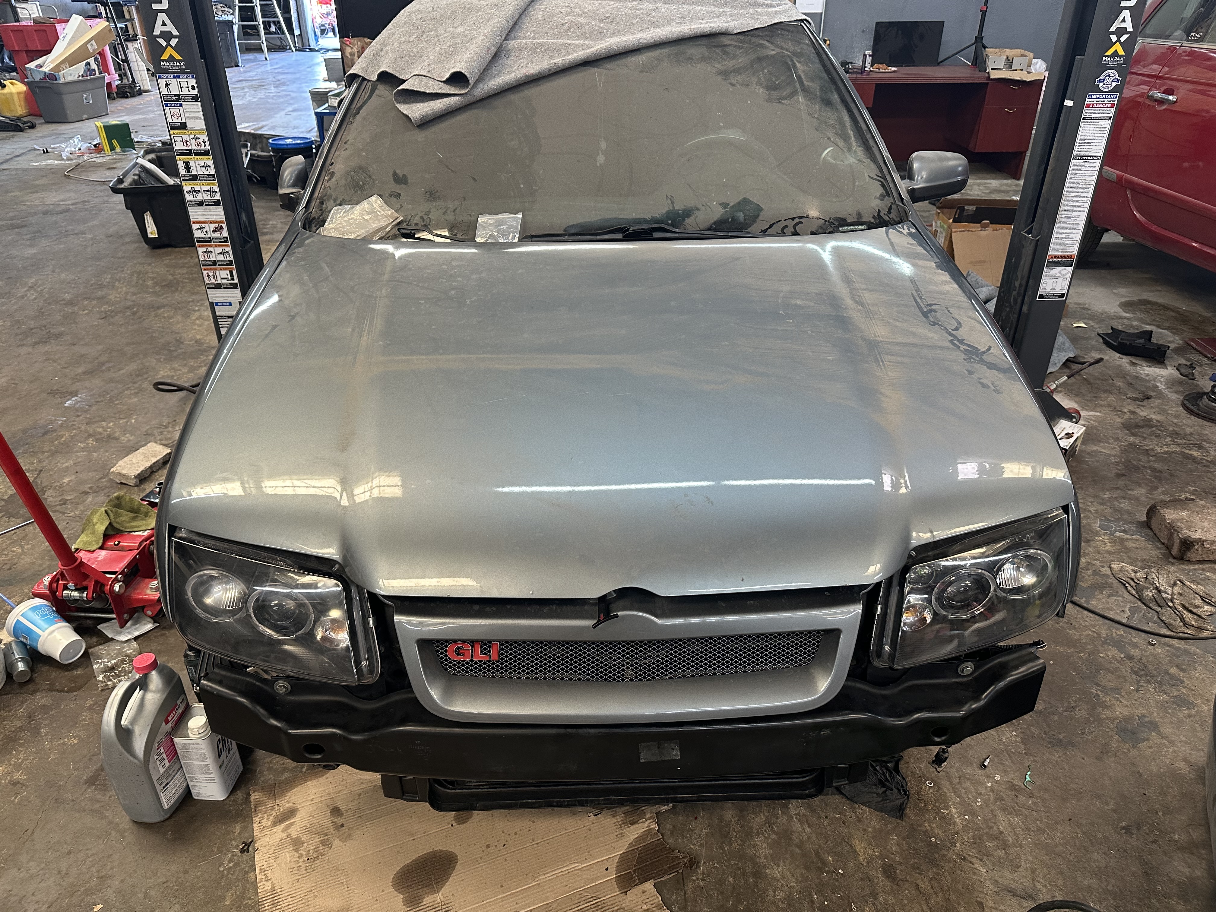 “Customer discussing motor swap options with Donny’s Automotive staff at the service counter, emphasizing transparency and customer care.” “Customer discussing motor swap options with Donny’s Automotive staff at the service counter, emphasizing transparency and customer care.”