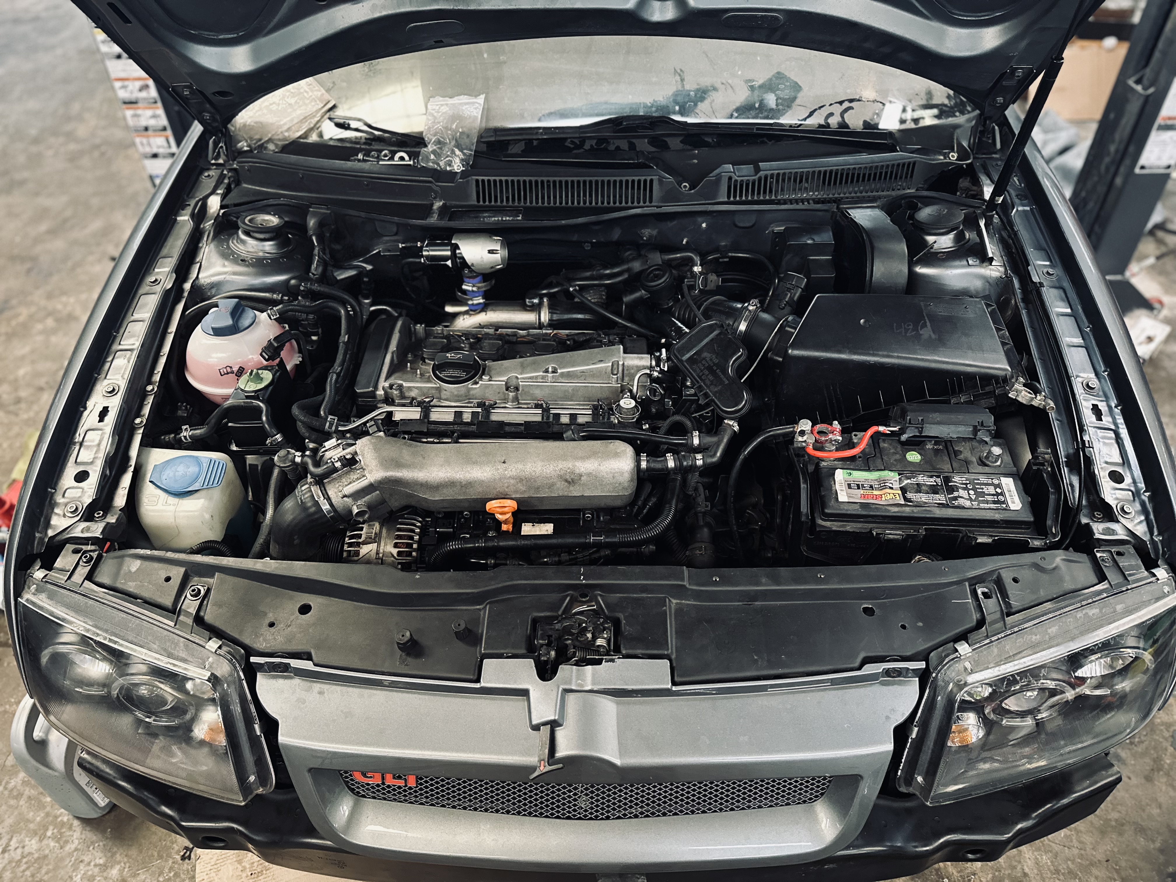 “Clean engine bay of a vehicle at Donny’s Automotive after a successful motor swap, highlighting quality workmanship.” “Clean engine bay of a vehicle at Donny’s Automotive after a successful motor swap, highlighting quality workmanship.”
