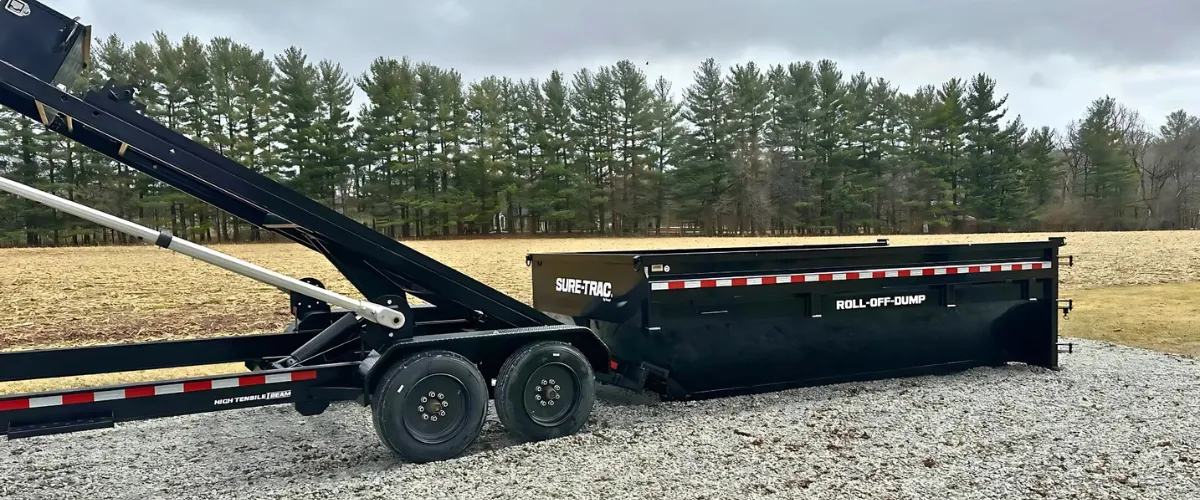 Roll-off dumpster placed on a gravel driveway in a rural Lizton property, ready for a cleanout project Roll-off dumpster placed on a gravel driveway in a rural Lizton property, ready for a cleanout project