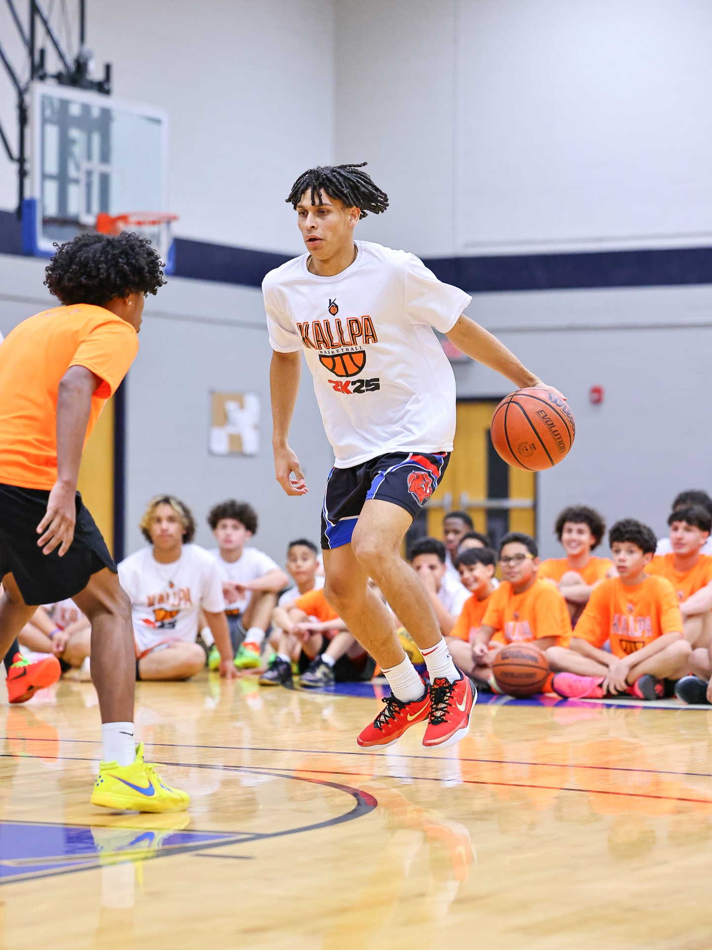 Kids training basketball skills