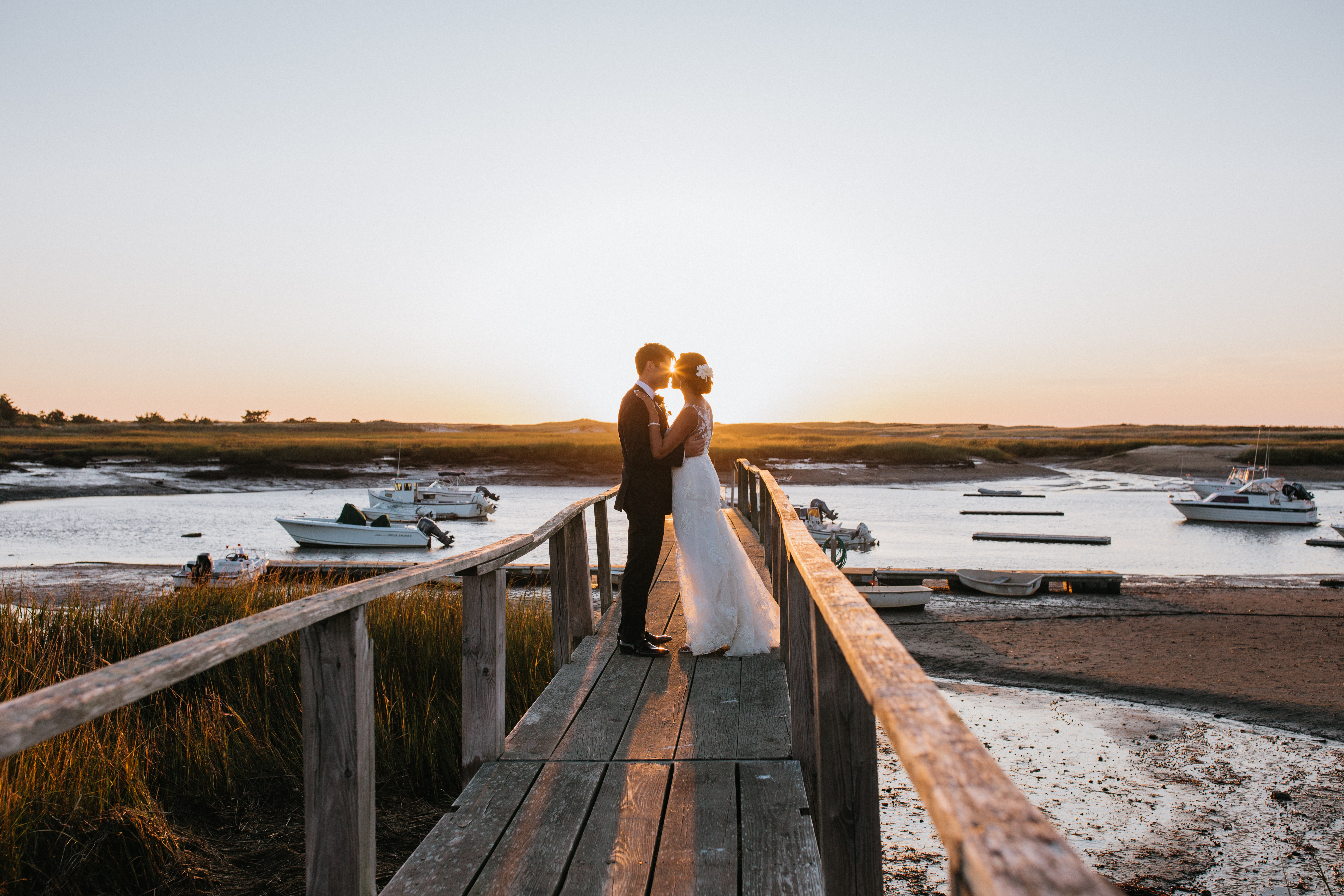 couple on cape cod beach during sunset