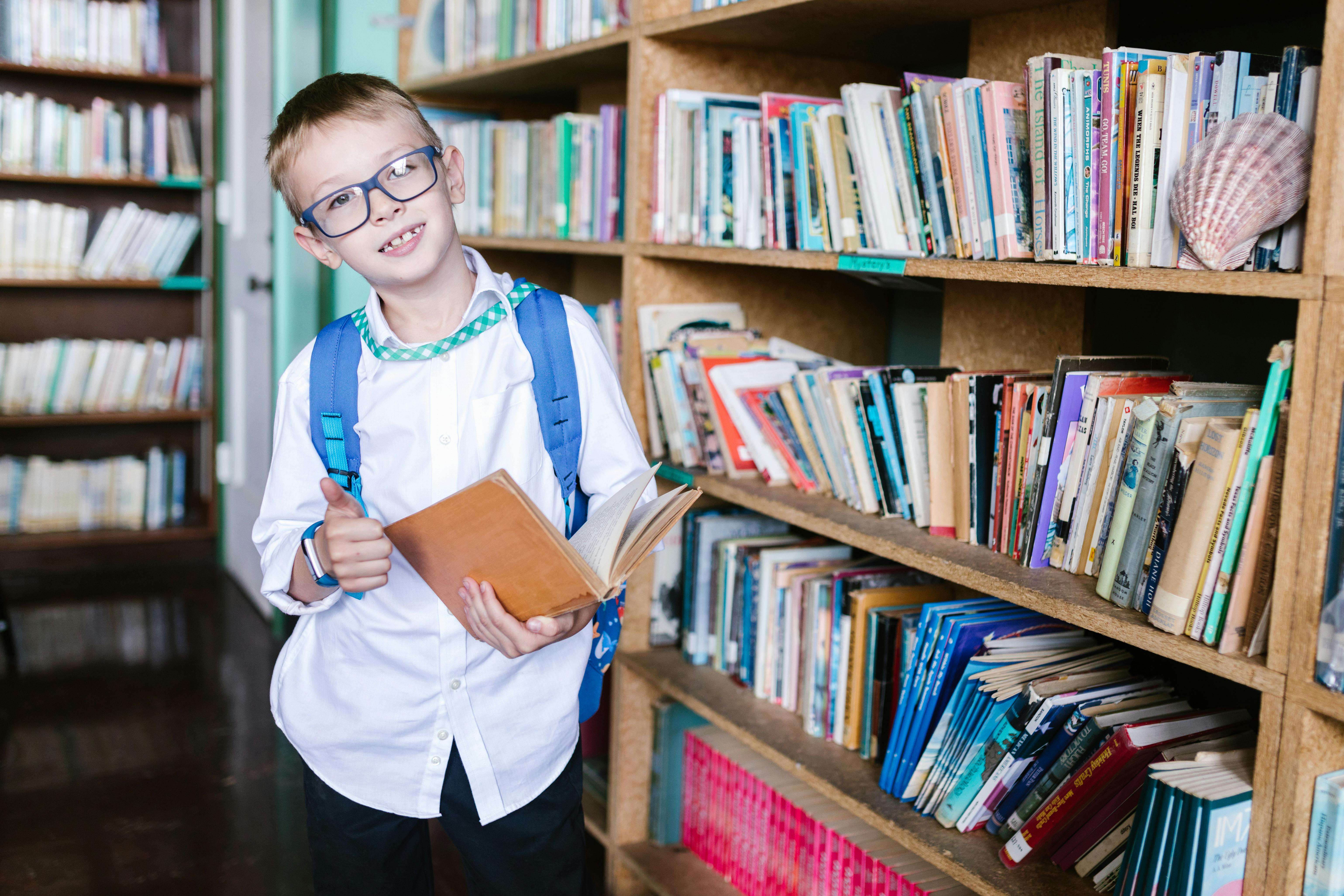 kid at library with book kid at library with book