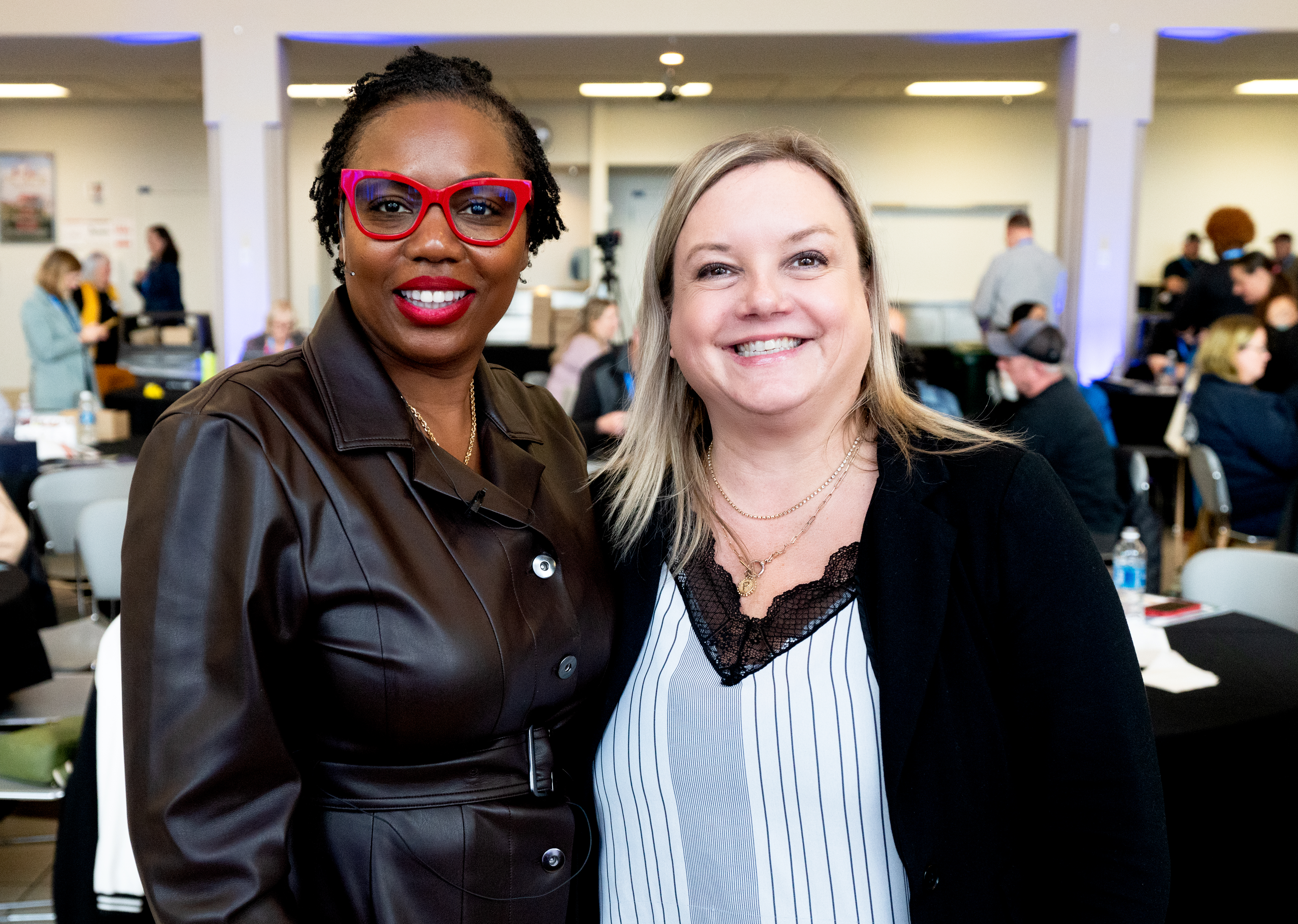 Two women standing side by side.