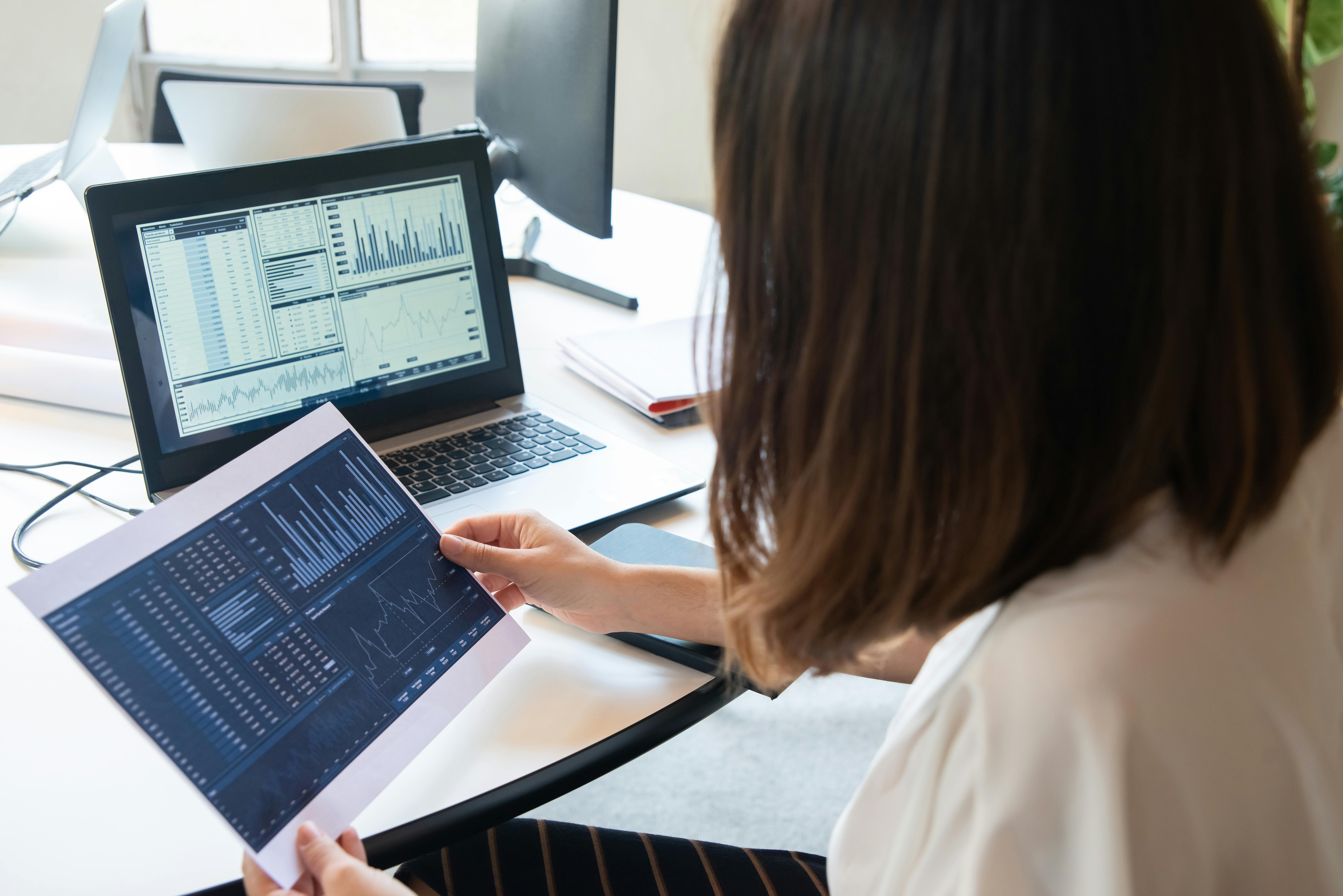 Small business owner analyzing email marketing performance