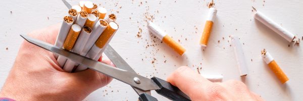 Cutting cigarettes with scissors