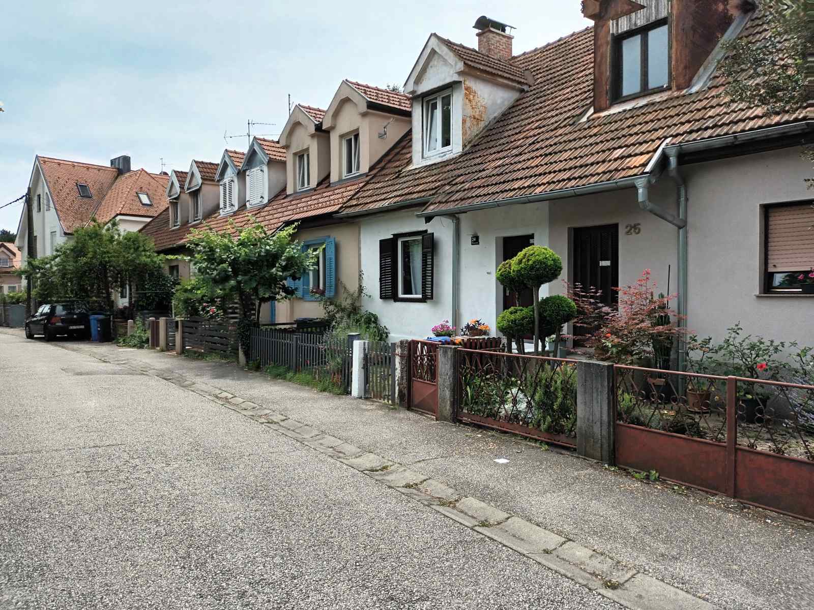 Row of historic railway workers' houses in Zagreb, birthplace of Mladen Kušec, renowned Croatian writer and storyteller, reflecting the simple, close-knit community of his childhood. Row of historic railway workers' houses in Zagreb, birthplace of Mladen Kušec, renowned Croatian writer and storyteller, reflecting the simple, close-knit community of his childhood.