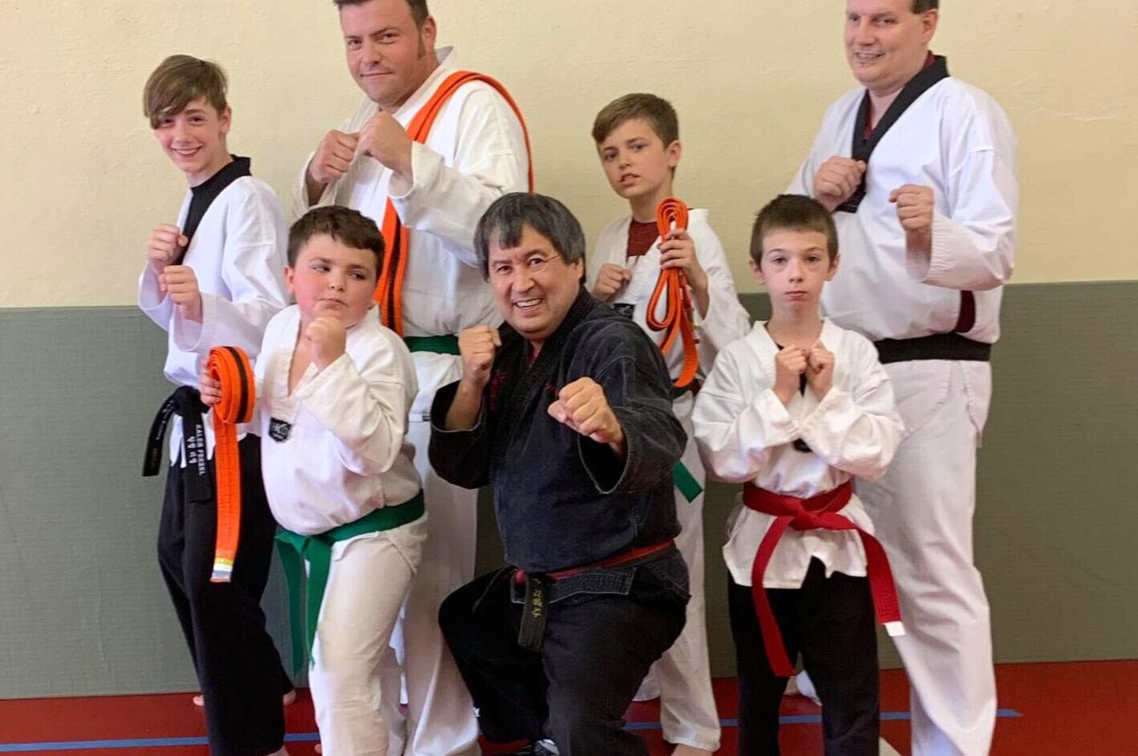 Martial arts instructor with kids