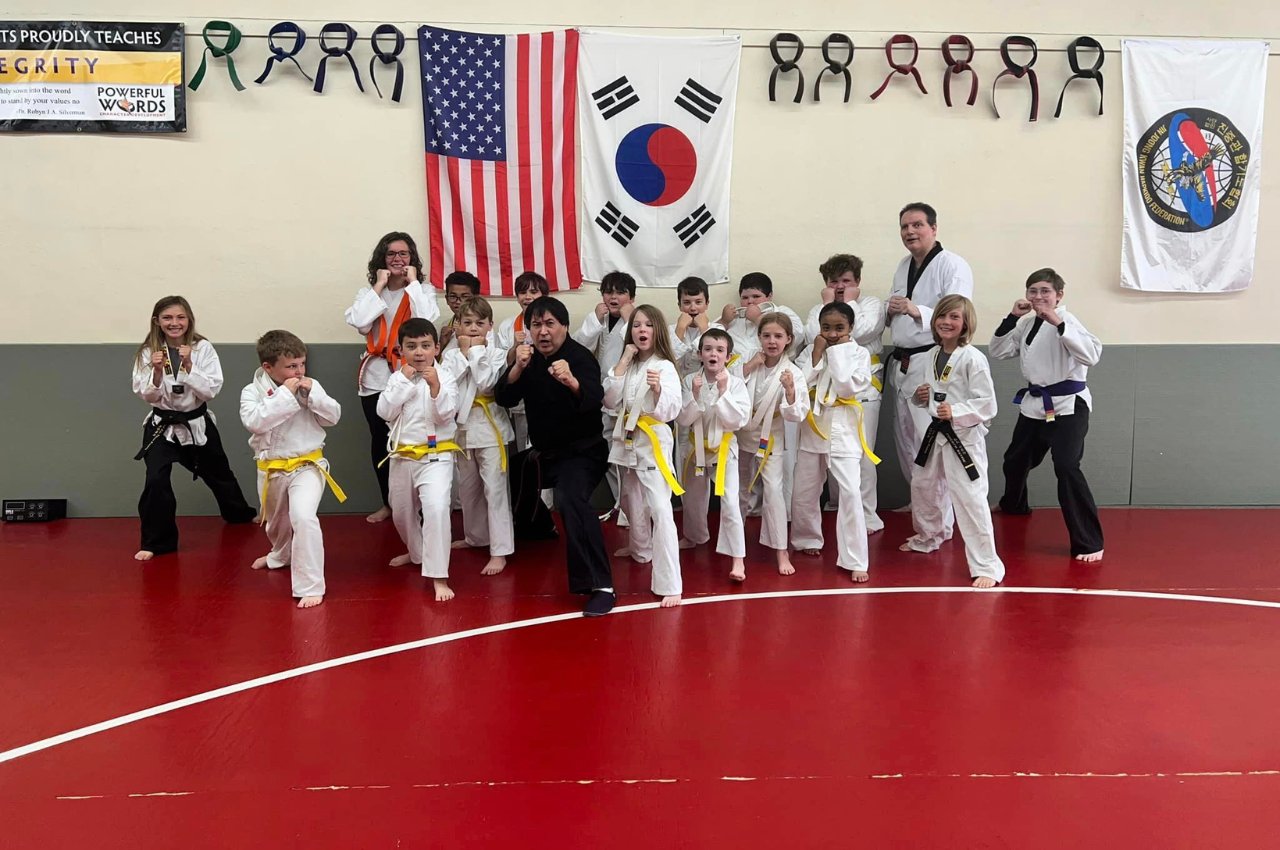 Martial arts instructor with kids