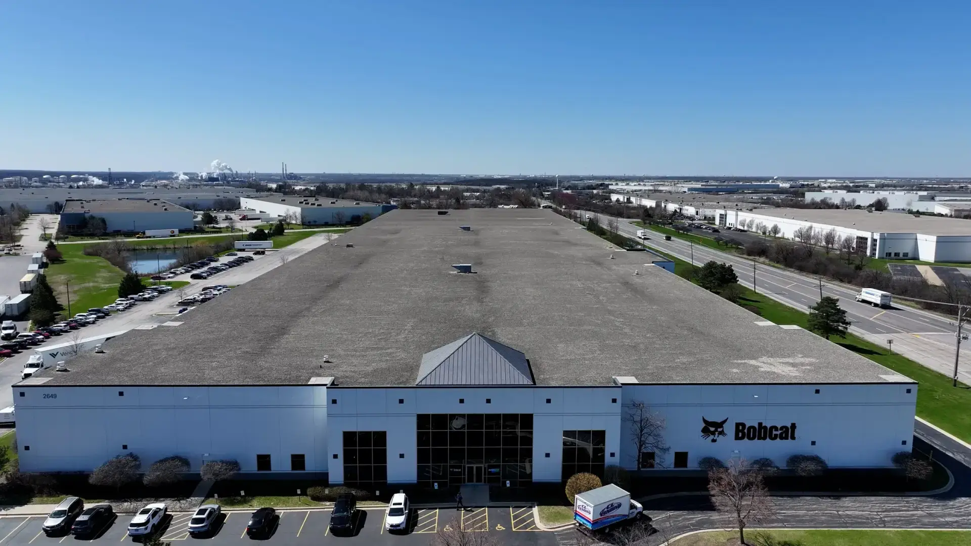 Bobcat Facility Romeoville — 243,050 sq ft EPDM Ballast Re-Skin commercial roofing project by Windward Roofing