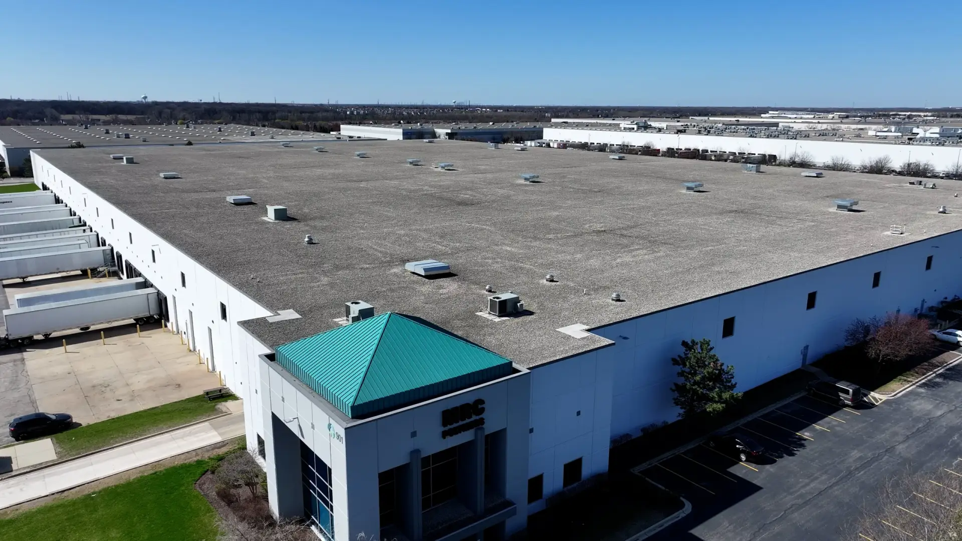 Romeoville 4 — 402,302 sq ft EPDM Ballast Re-Skin commercial roofing project by Windward Roofing
