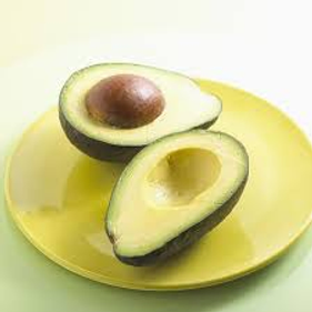 two avocado halves on a plate