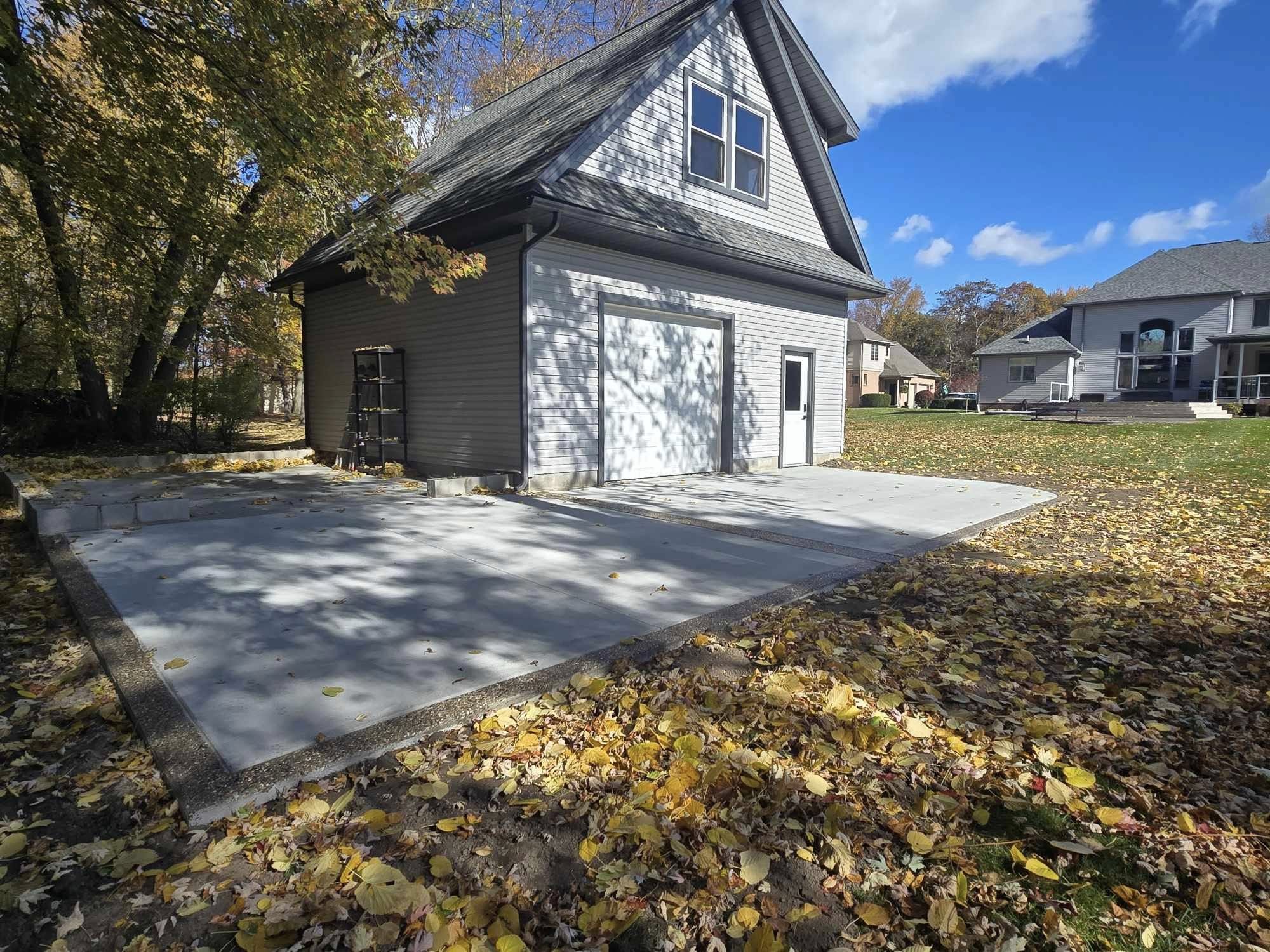 Custom concrete patio outside of a pole barn