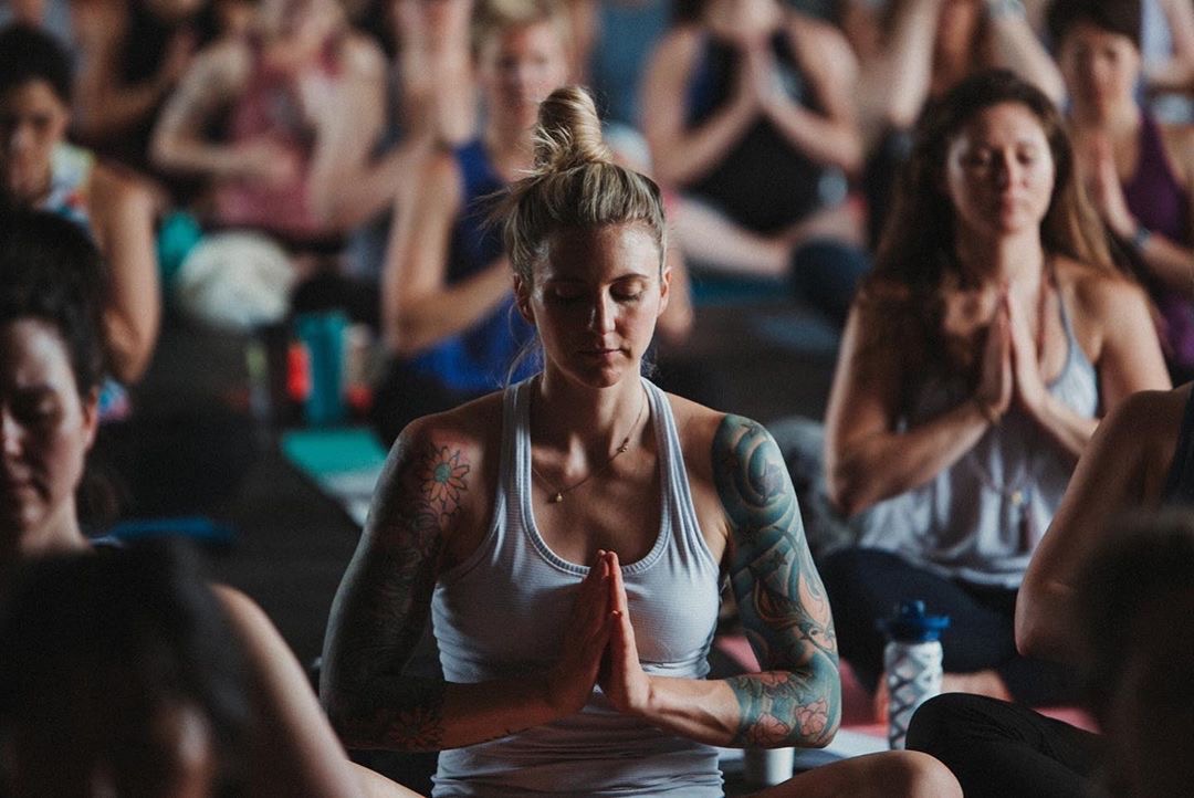 Women at a wellness summit, Dr. K in the background