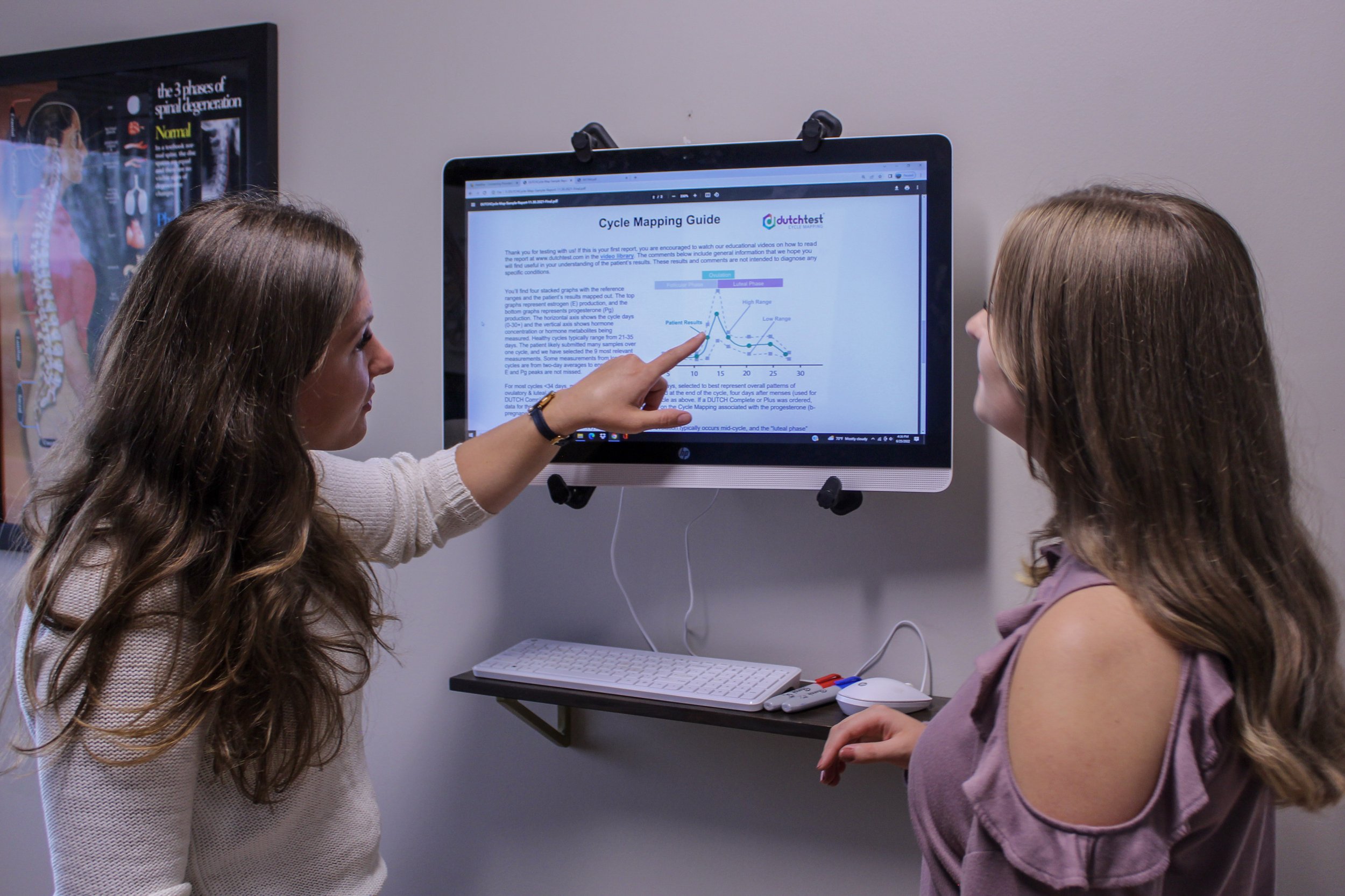 Dr. K reviewing hormone panel results with a patient in office