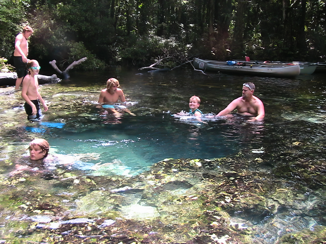 Some of our friends are sitting on the side of the water "hole" where some of the "tubes" are that you can swim through. The water is crystal clear. Some of our friends are sitting on the side of the water "hole" where some of the "tubes" are that you can swim through. The water is crystal clear.