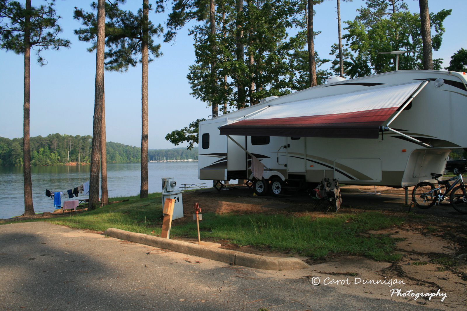 View of our 5th Wheel RV on the lake at Wind Creek State Park in Alabama.